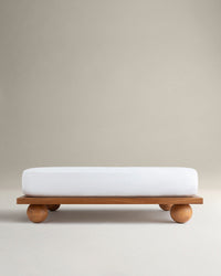 Image 1 of 6 showing Rise & Fall's Crisp & Cool organic cotton fitted sheet in white.