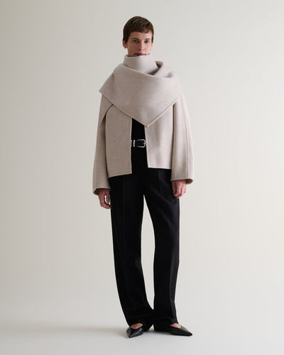 Image 1 of 9 showing woman wearing Rise & Fall's twine cashmere wool double faced scarf jacket with black trousers.