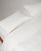 Image 2 of 3 showing Rise & Fall's Crisp & Cool Organic Cotton Pillowcases Set, colour: Buttermilk Ticking Stripe.