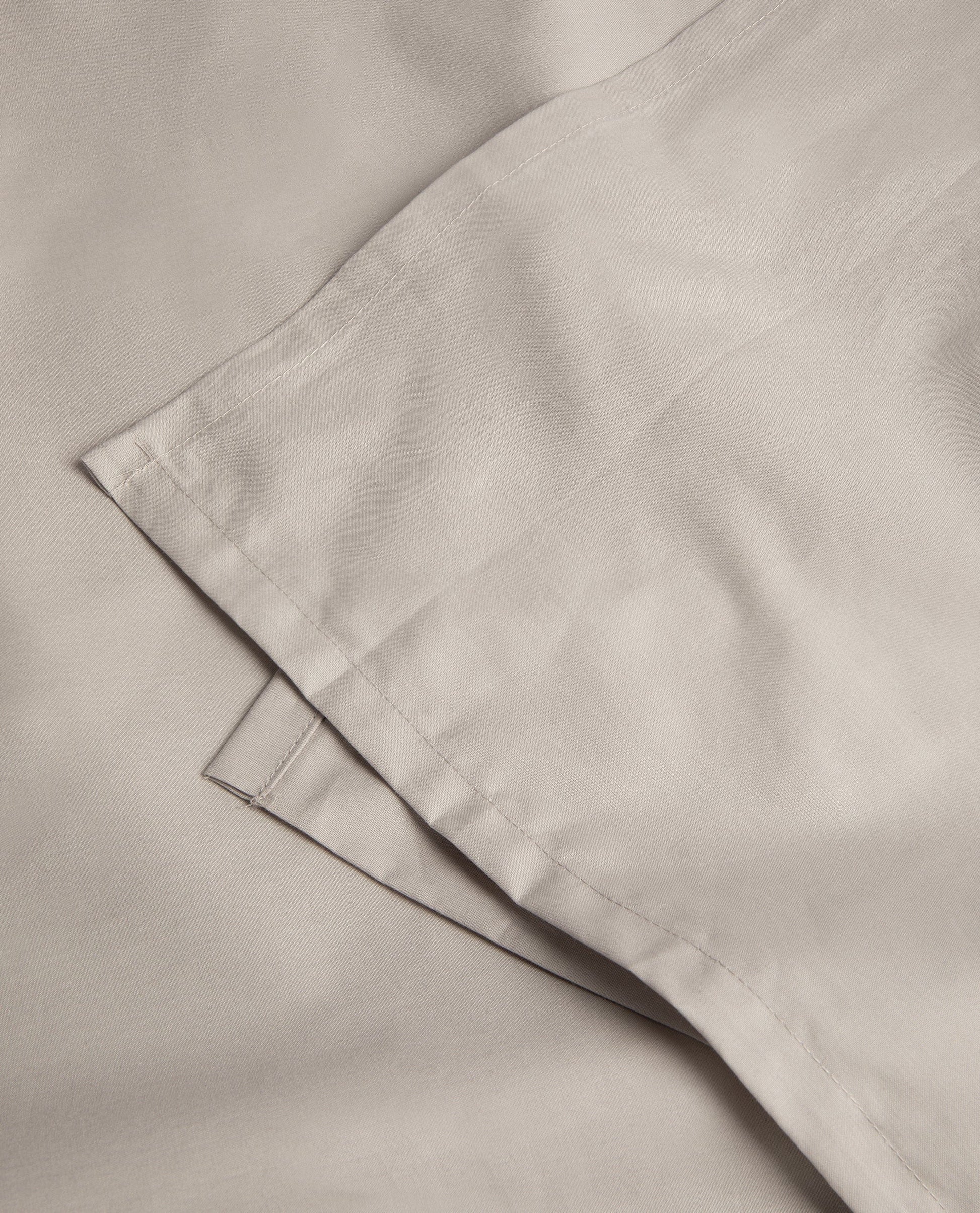 Image 2 of 3 showing Rise & Fall's Soft & Smooth organic sateen cotton flat sheet in pebble.
