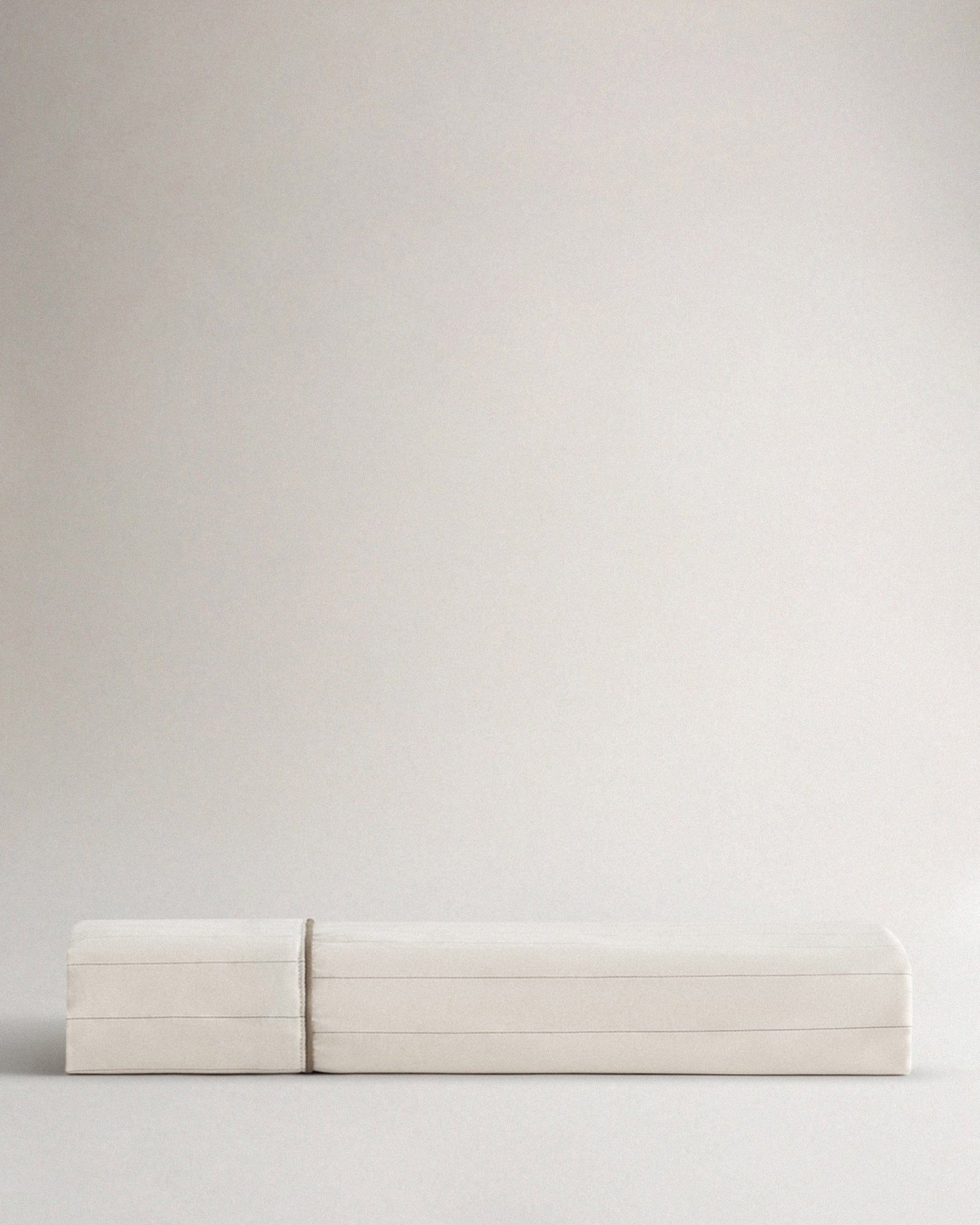 Image 2 of 3 showing Rise & Fall's Soft & Smooth organic sateen cotton flat sheet in buttermilk stripe.
