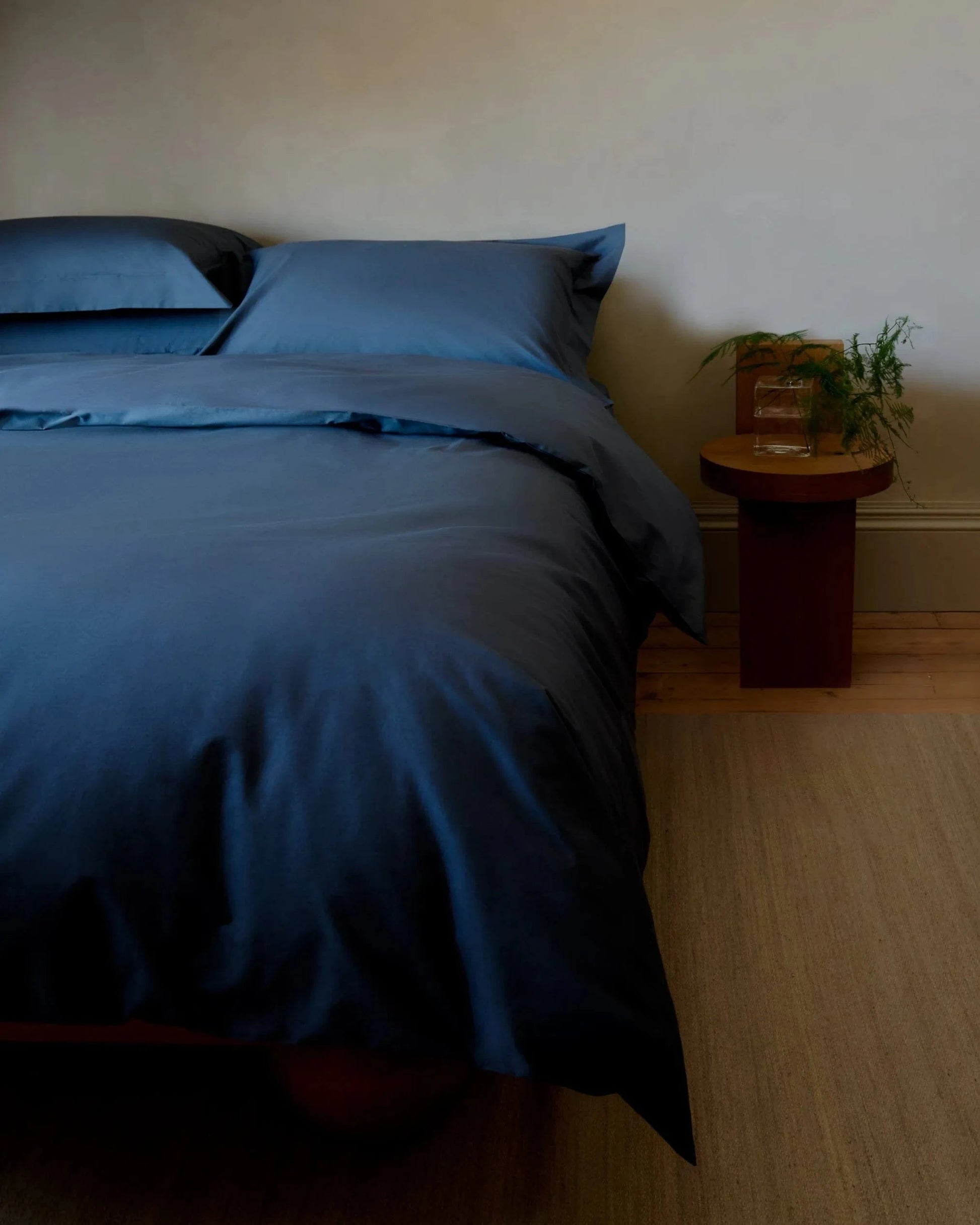 image 2 of 3 showing bed with Rise & Fall's Crisp & Cool duvet set, colour: mood indigo, fabric: percale cotton