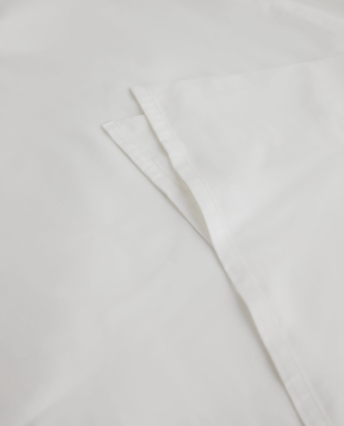 Image 2 of 3 showing Rise & Fall's Soft & Smooth organic sateen cotton flat sheet in white.