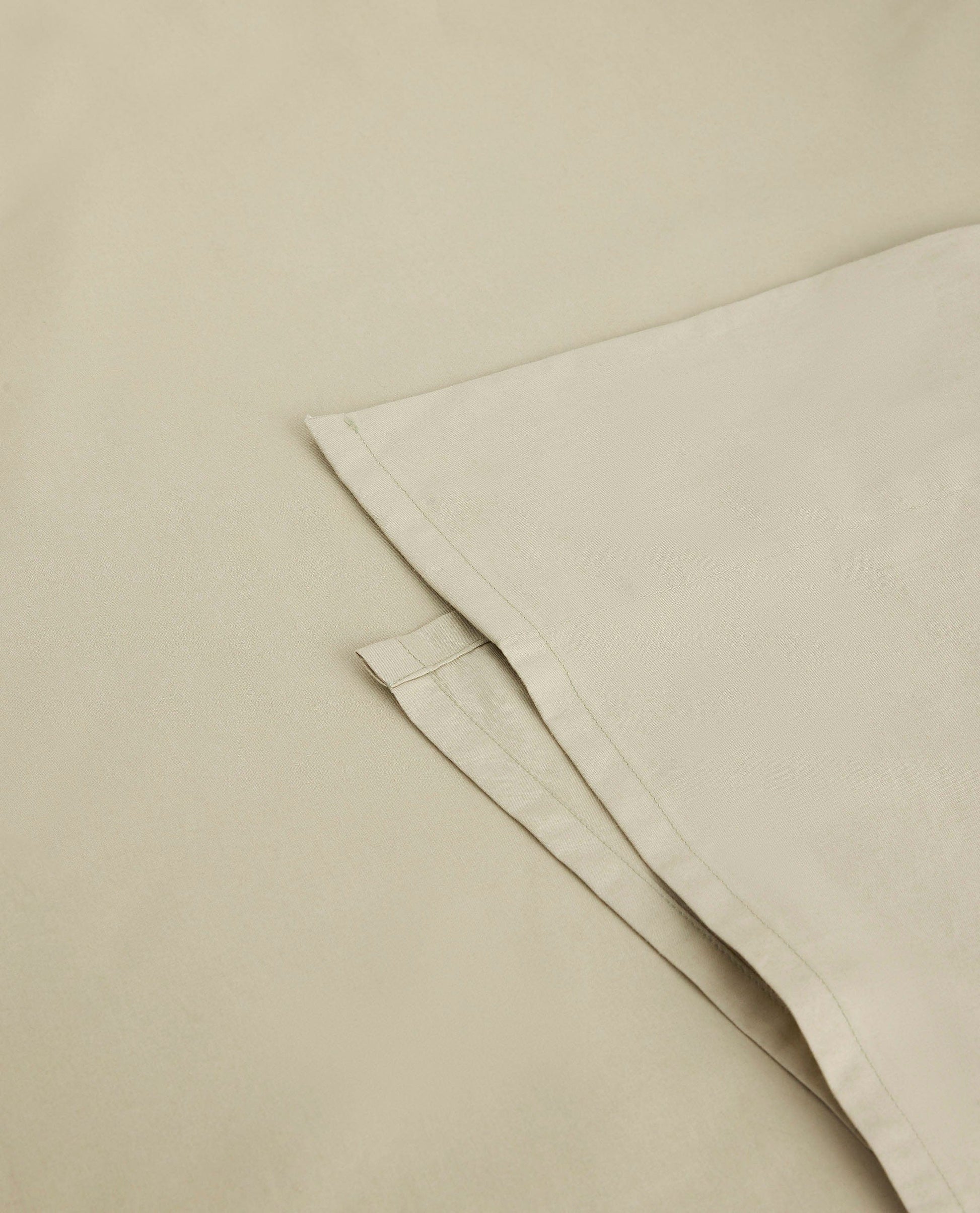 Image 2 of 4 showing Rise & Fall's Crisp & Cool organic percale cotton flat sheet in sage.