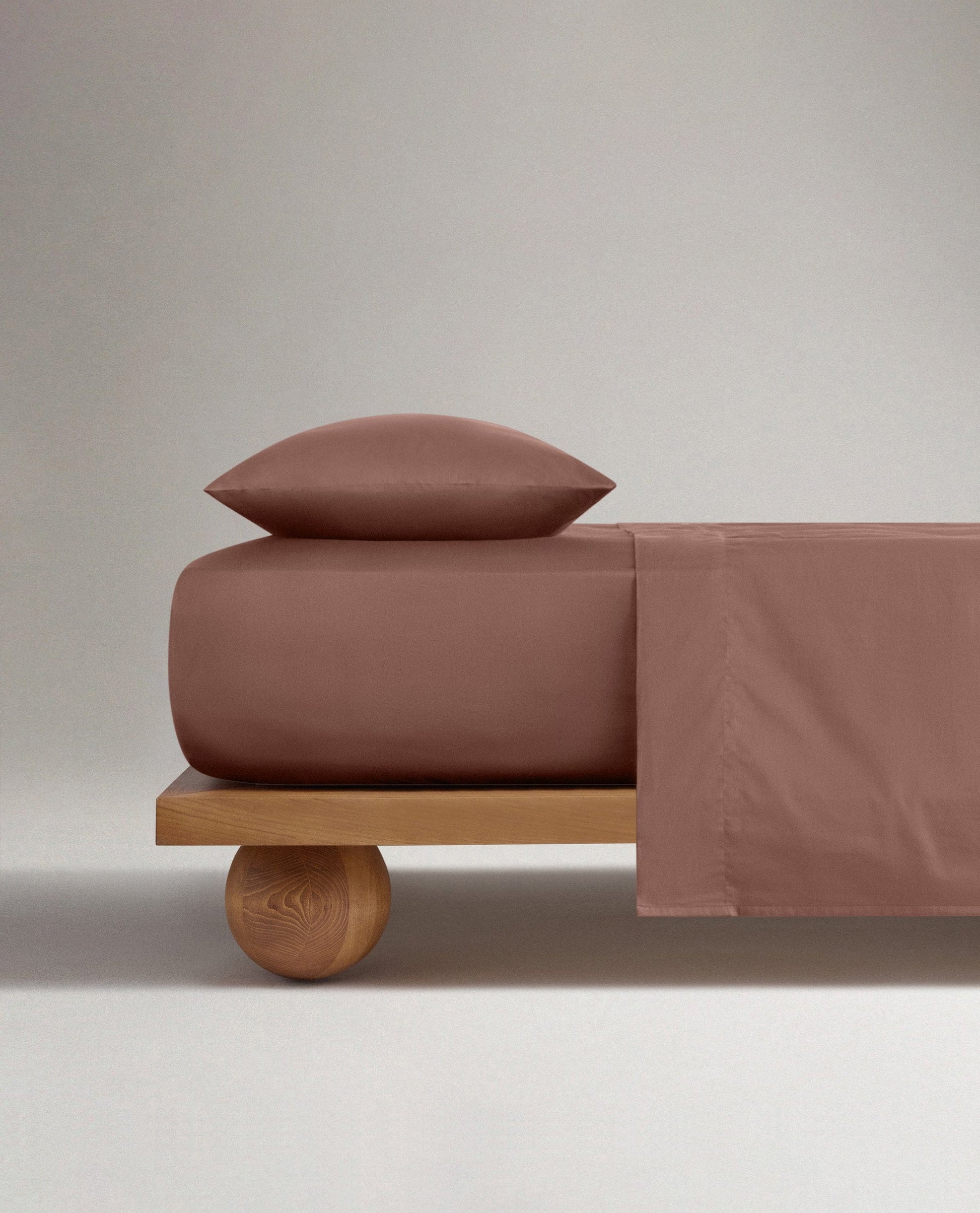 Image 2 of 4 showing Rise & Fall's Soft & Smooth Cotton Sateen Pillowcase Set in clay.