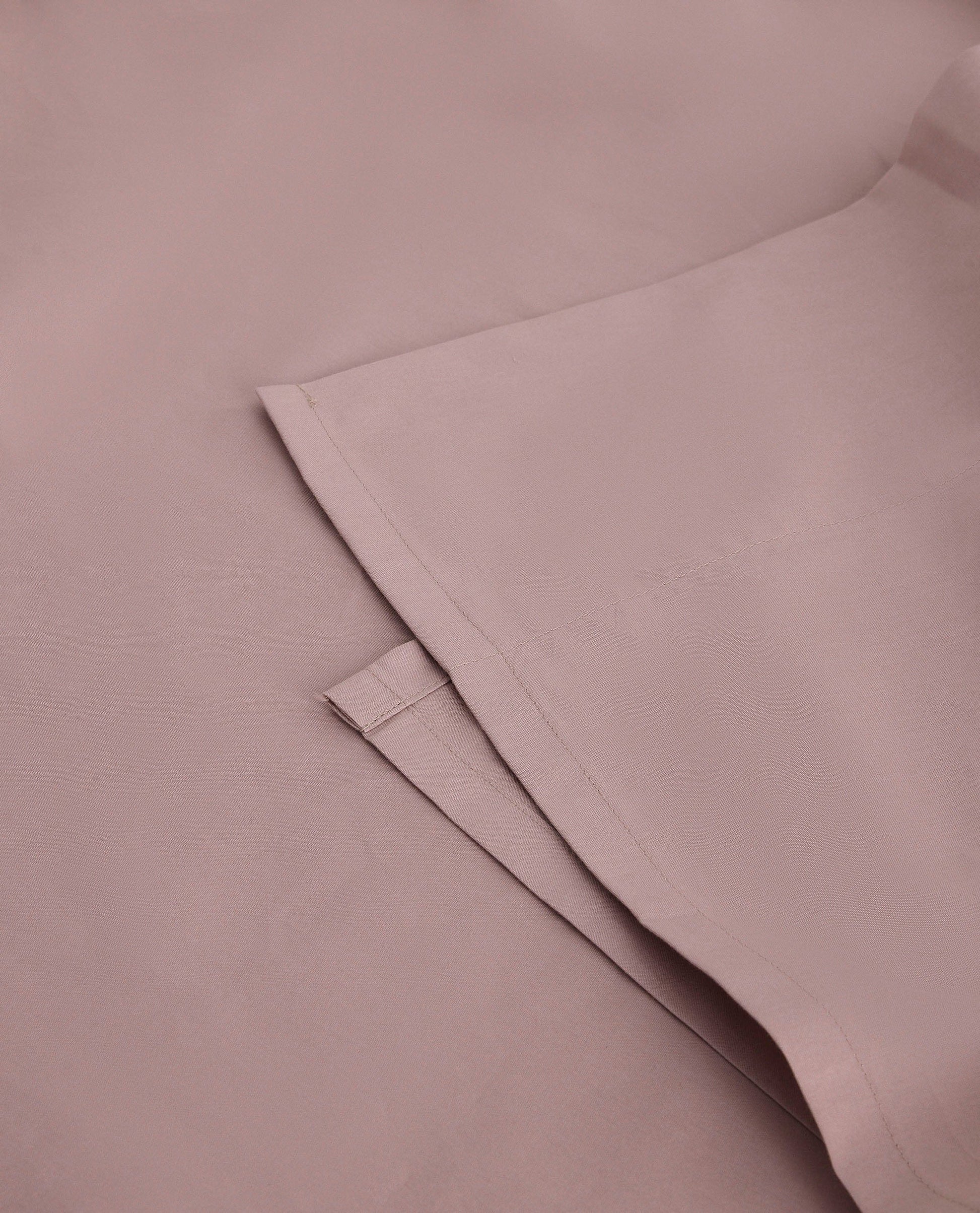 Image 2 of 4 showing Rise & Fall's Soft & Smooth organic sateen cotton flat sheet in deep clay.
