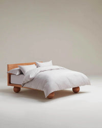 image 2 of 5 showing bed made with Rise & Fall's pebble crisp & cool duvet set in percale cotton