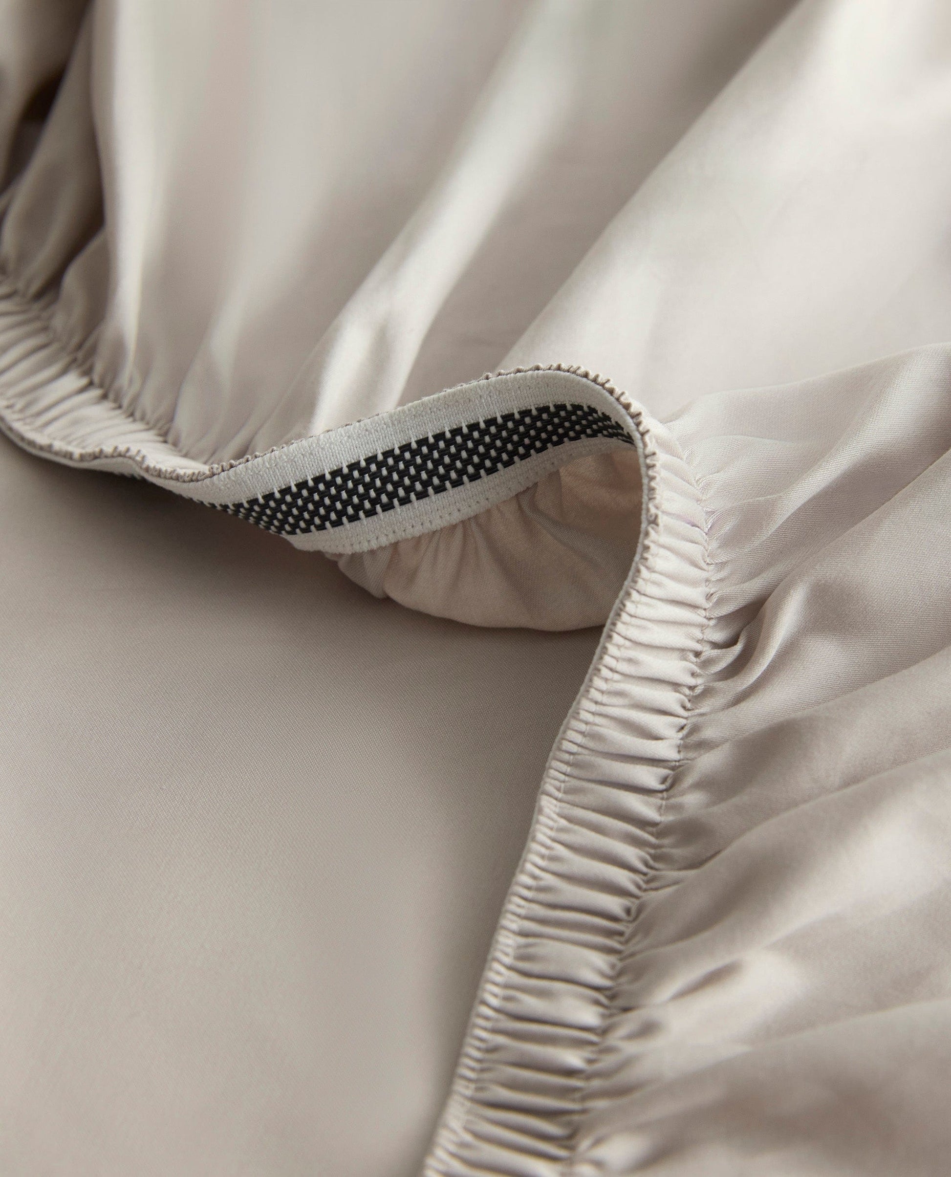 Image 2 of 5 showing Rise & Fall's Crisp & Cool organic cotton deep fitted sheet in pebble.