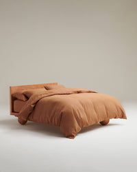 image 2 of 6 showing bed with Rise & Fall's Relaxed & Refined linen duvet set, fabric: European flax, colour: ochre