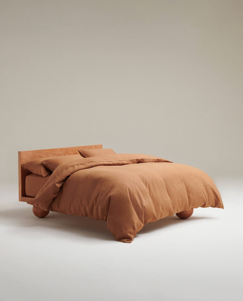 image 2 of 6 showing bed with Rise & Fall's Relaxed & Refined linen duvet set, fabric: European flax, colour: ochre