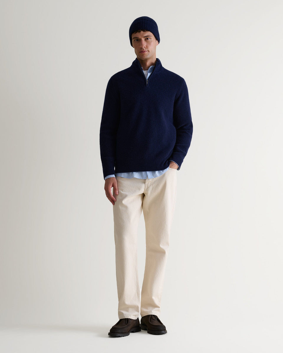 Image 3 of 3 showing man wearing Rise & Fall's Cashmere Merino Ribbed Knit Beanie in navy.