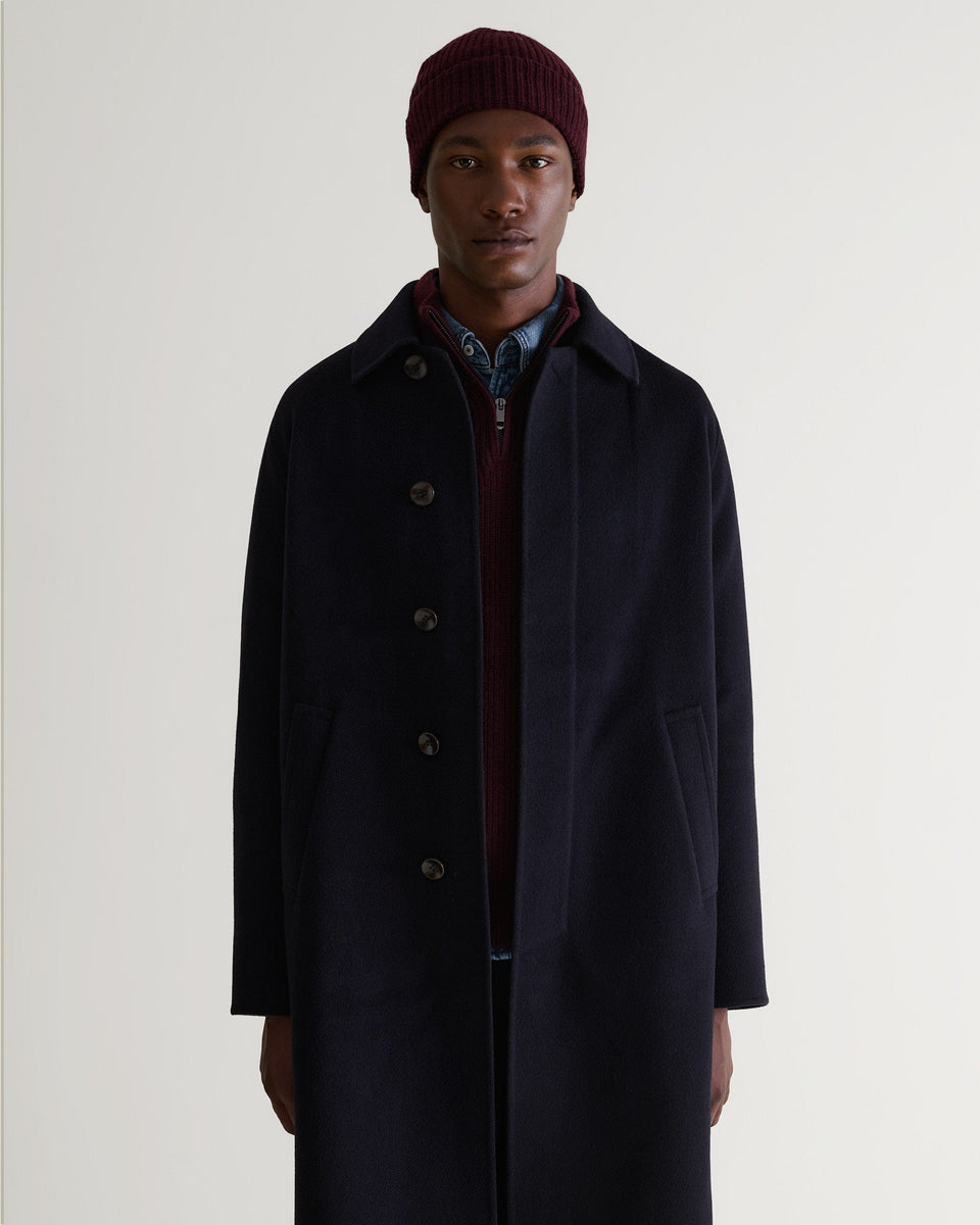 Image 3 of 3 showing man wearing Rise & Fall's Cashmere Merino Ribbed Knit Beanie in oxblood.