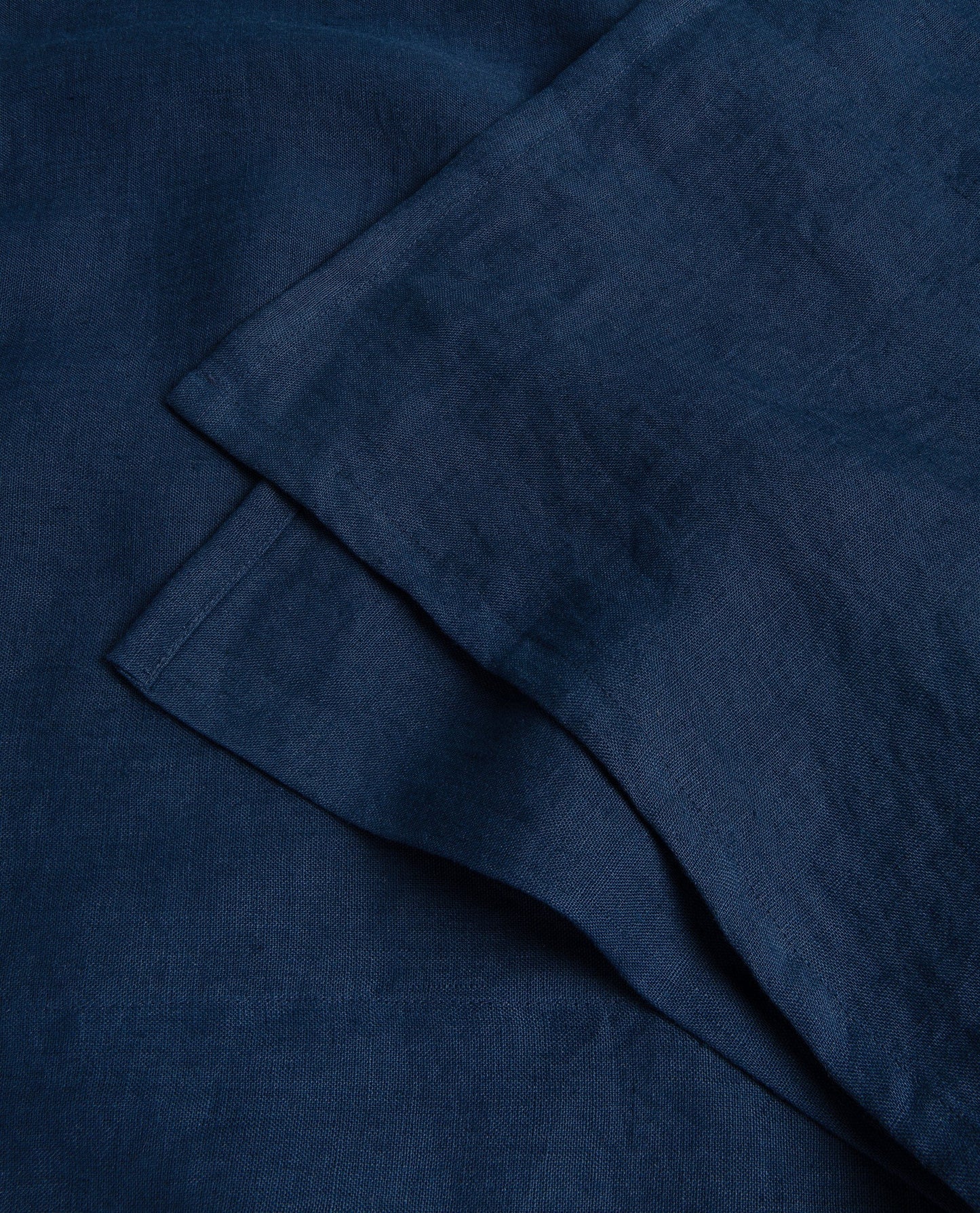 Image 3 of 3 showing Rise & Fall's Relaxed & Refined linen flat bed sheet in indigo.