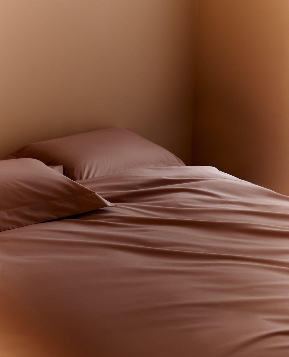 Image 3 of 3 showing Rise & Fall's sateen cotton duvet cover, colour: deep clay.