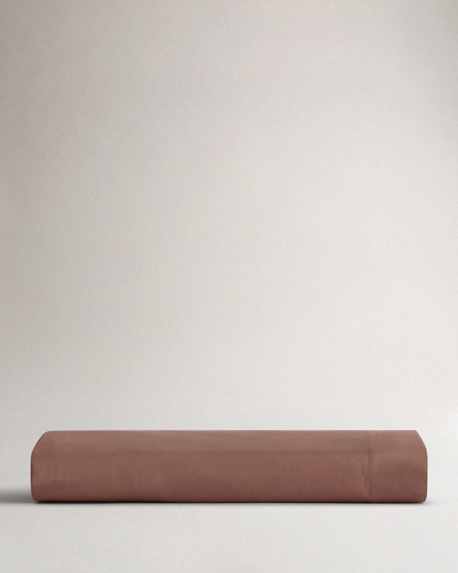 Image 3 of 4 showing Rise & Fall's Soft & Smooth organic sateen cotton flat sheet in deep clay. 