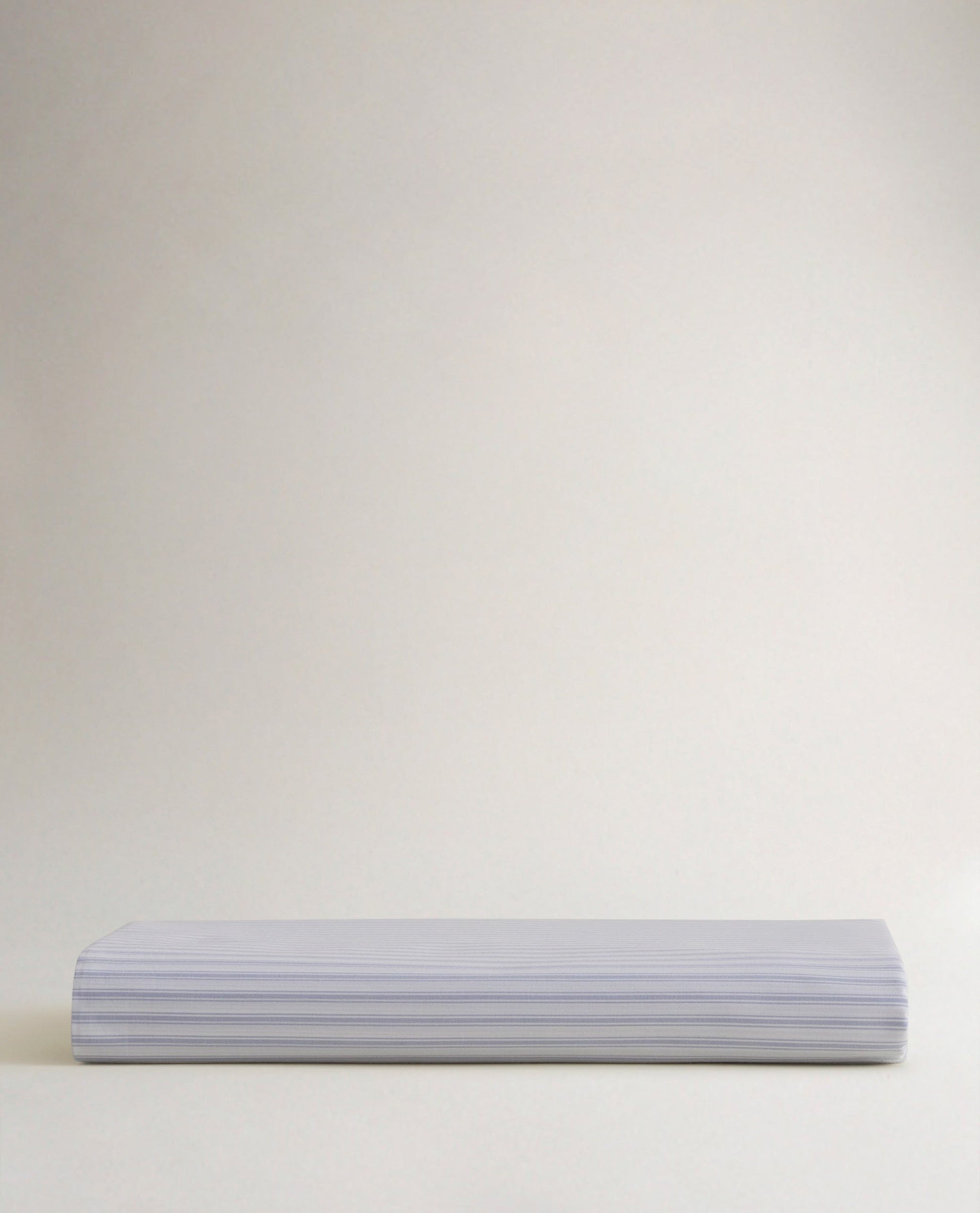Image 3 of 5 showing Rise & Fall's Crisp & Cool organic percale cotton flat bed sheet in blue ticking stripe.