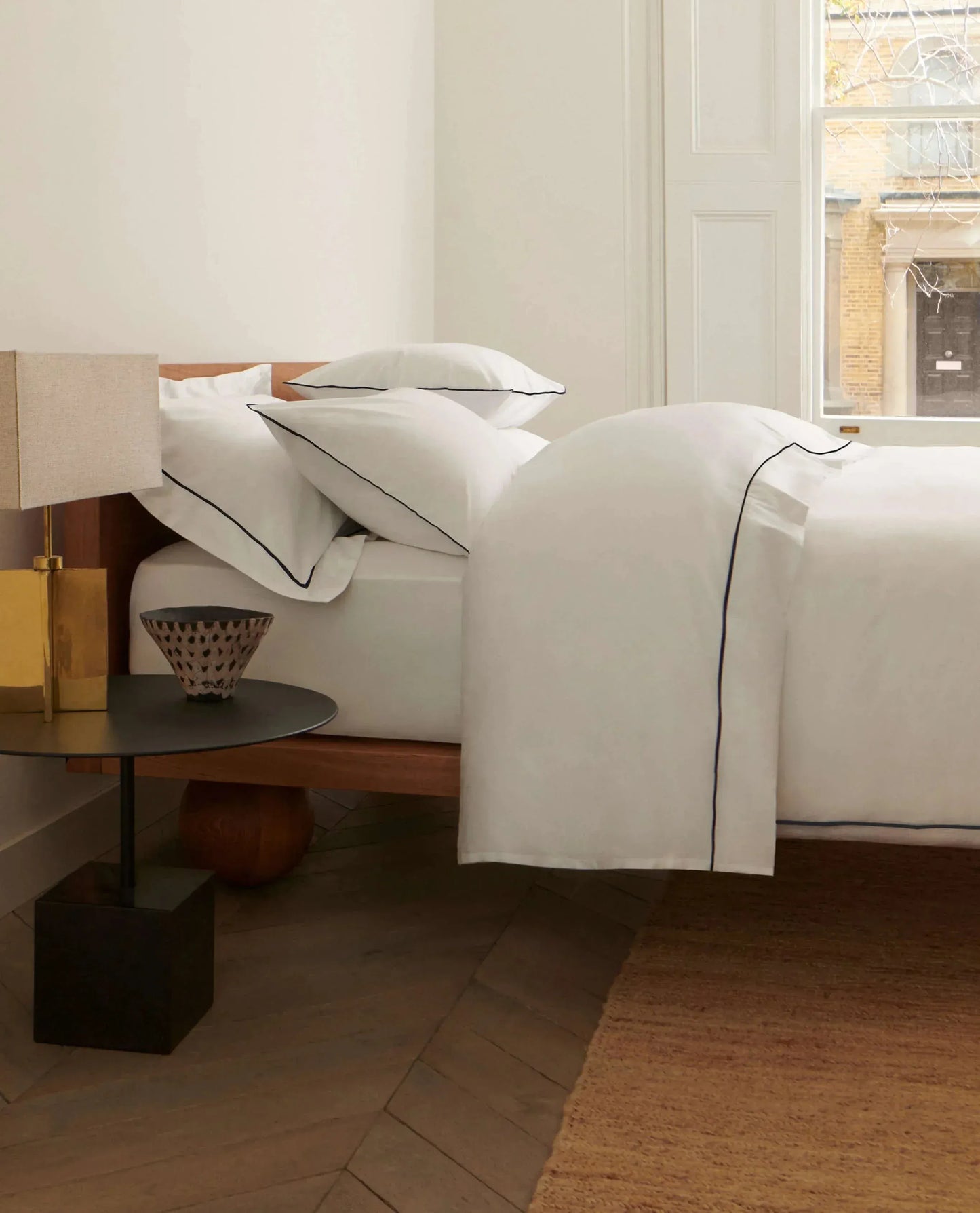 Image 3 of 5 showing Rise & Fall's Soft & Smooth organic sateen cotton comforter set, colour: white navy piping, size: king.