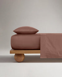 Image 3 of 5 showing Rise & Fall's Soft & Smooth sateen cotton deep fitted sheet in clay.