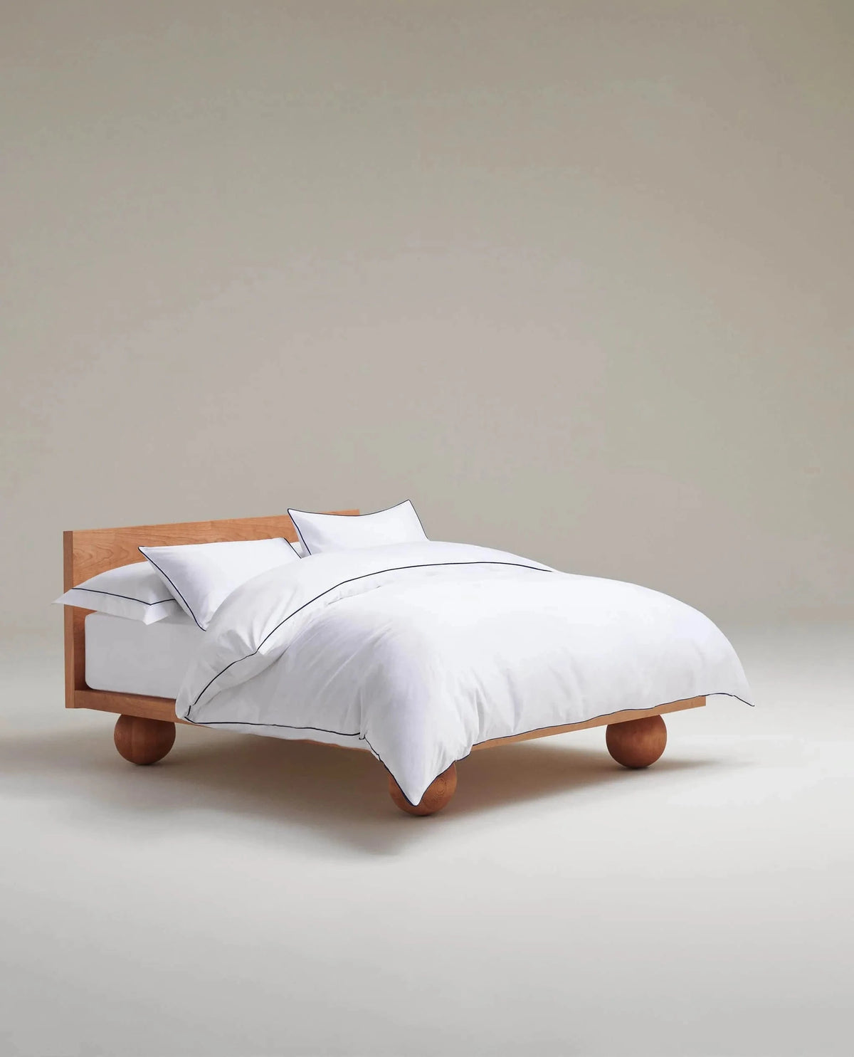 image 3 of 5 showing bed with Rise & Fall's Crisp & Cool duvet set, colour: white navy piping, fabric: percale cotton