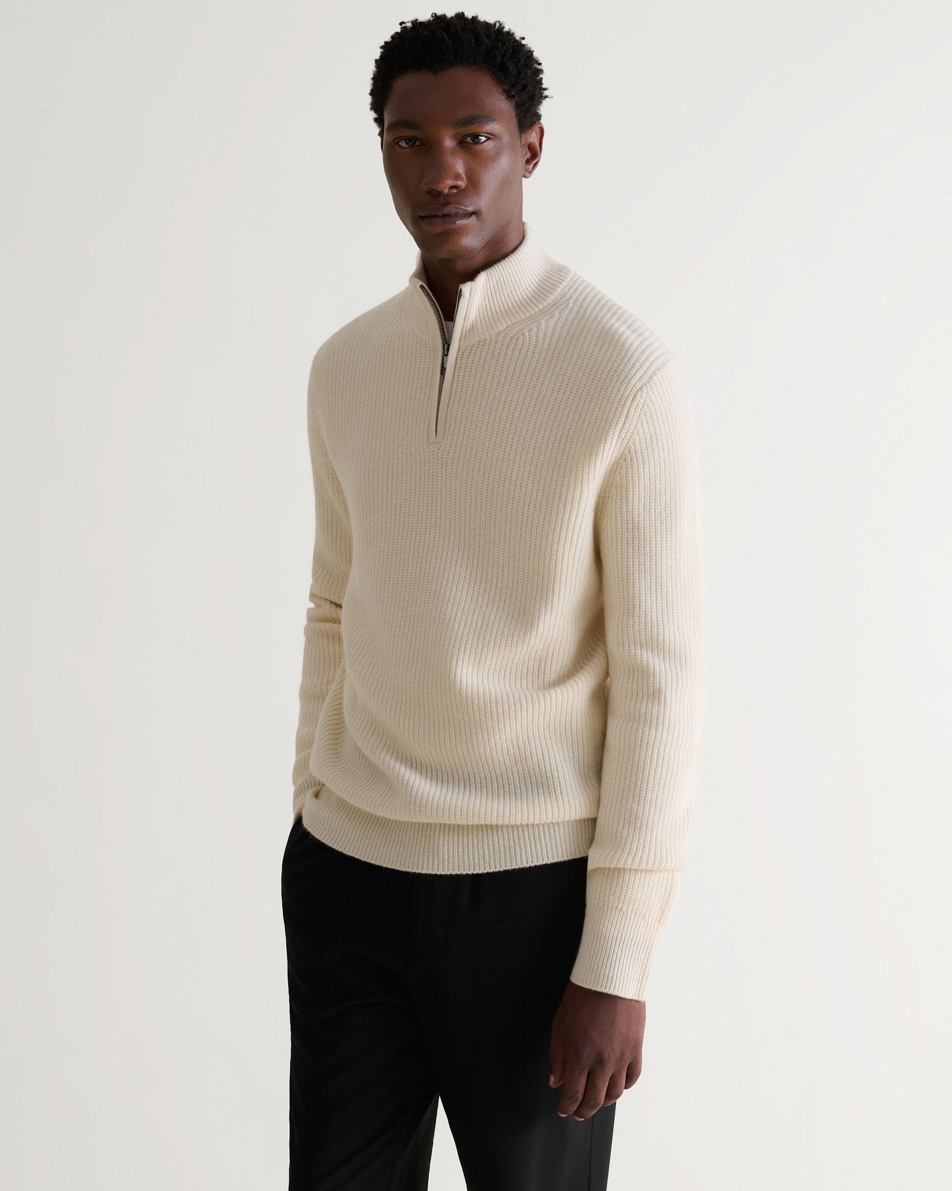 Image 3 of 6 showing man wearing Rise & Fall's Cashmere Merino Fishermans Rib 1/4 Zip Jumper in cream.
