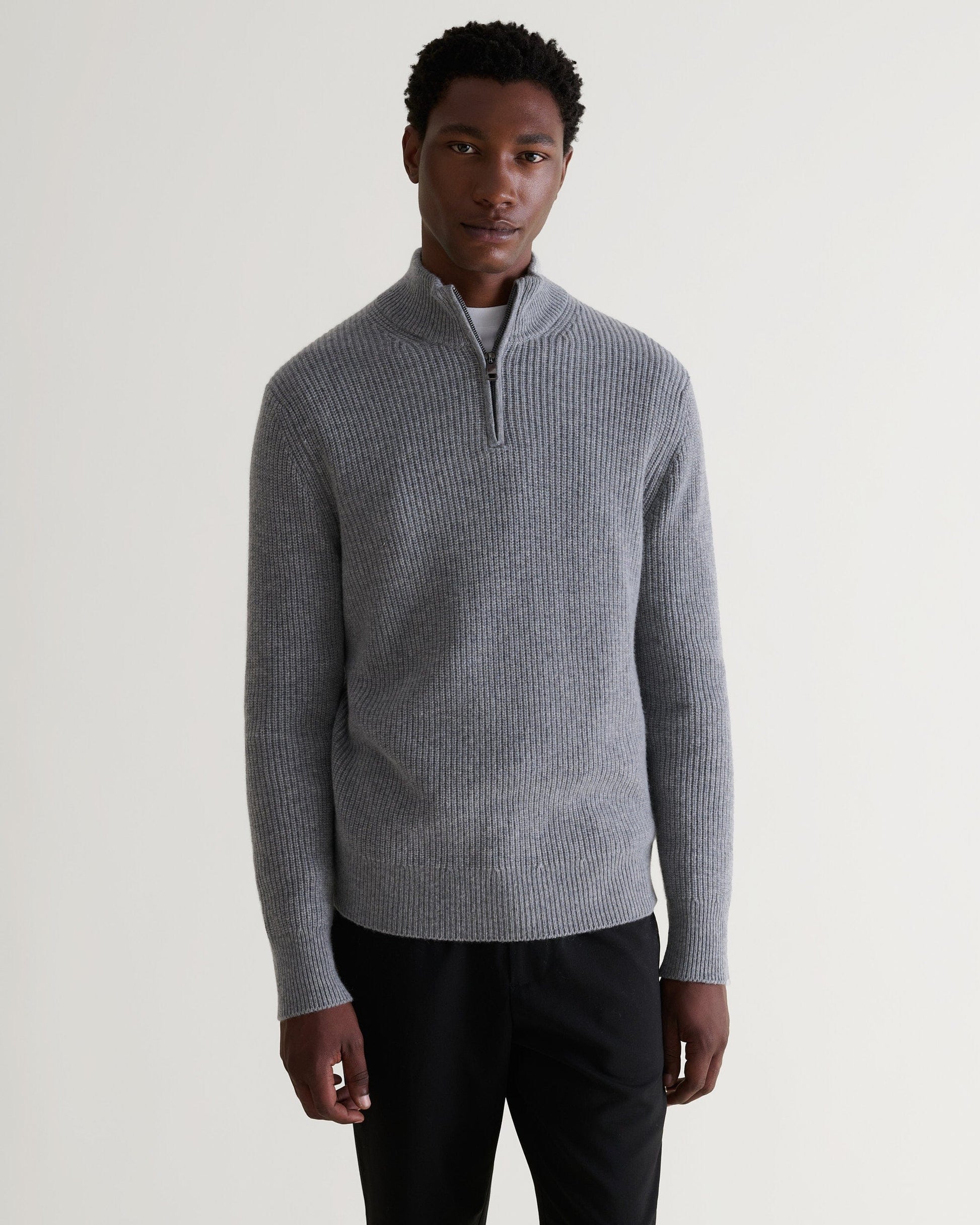 Image 3 of 6 showing man wearing Rise & Fall's Cashmere Merino Fishermans Rib 1/4 Zip Jumper in grey.