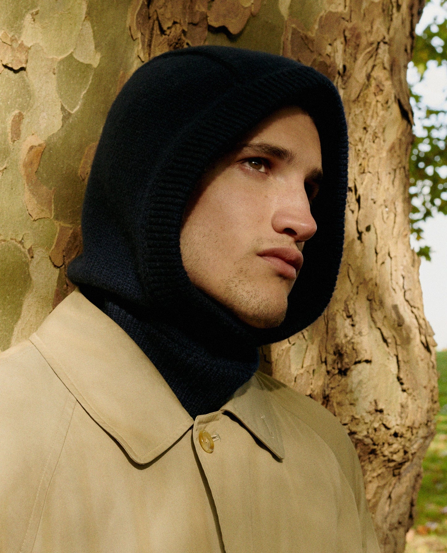 Image 4 of 4 showing man wearing Rise & Fall's black Cashmere Merino Knitted Hood.