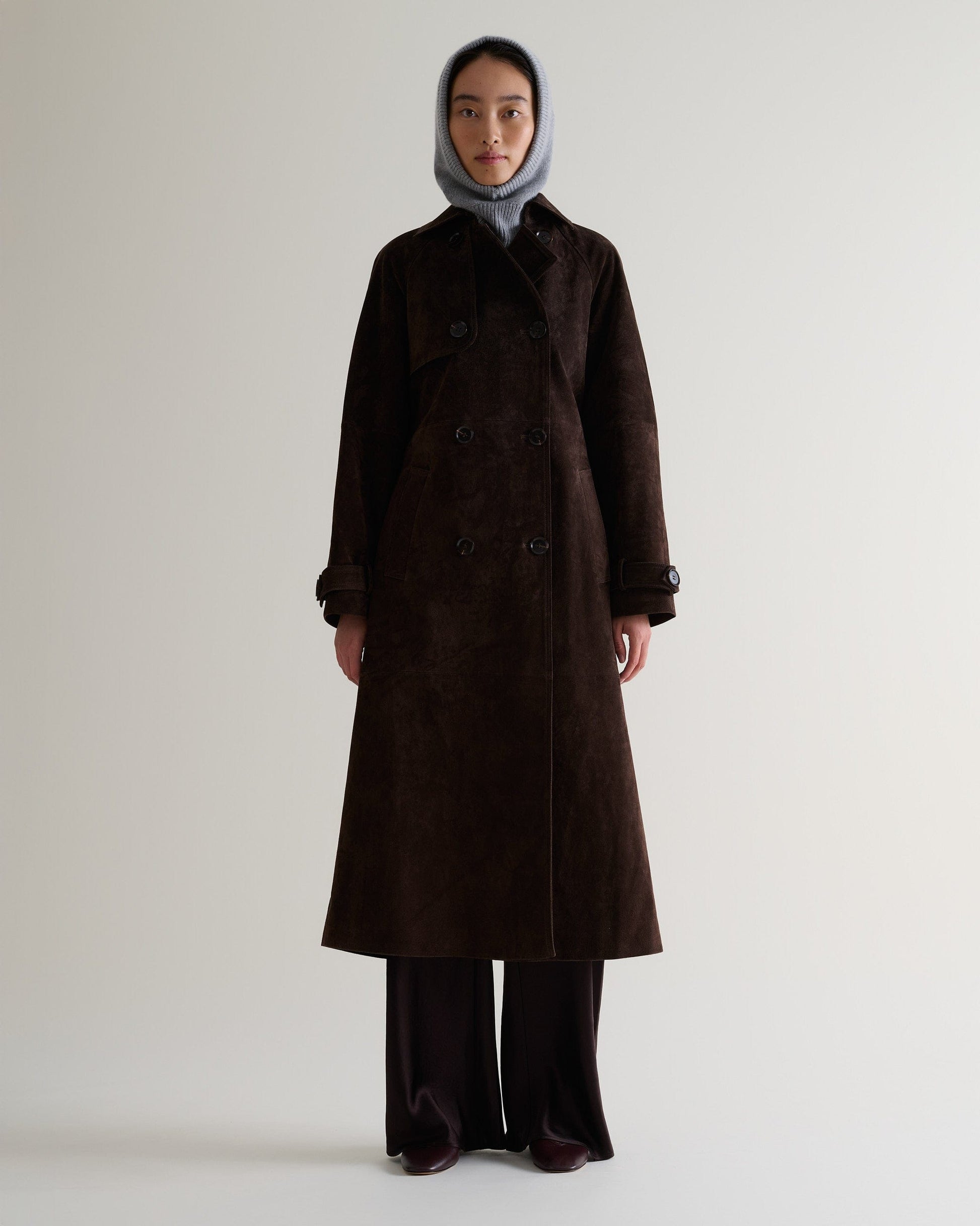 Image 4 of 4 showing woman wearing Rise & Fall's grey Cashmere Merino Knitted Hood.