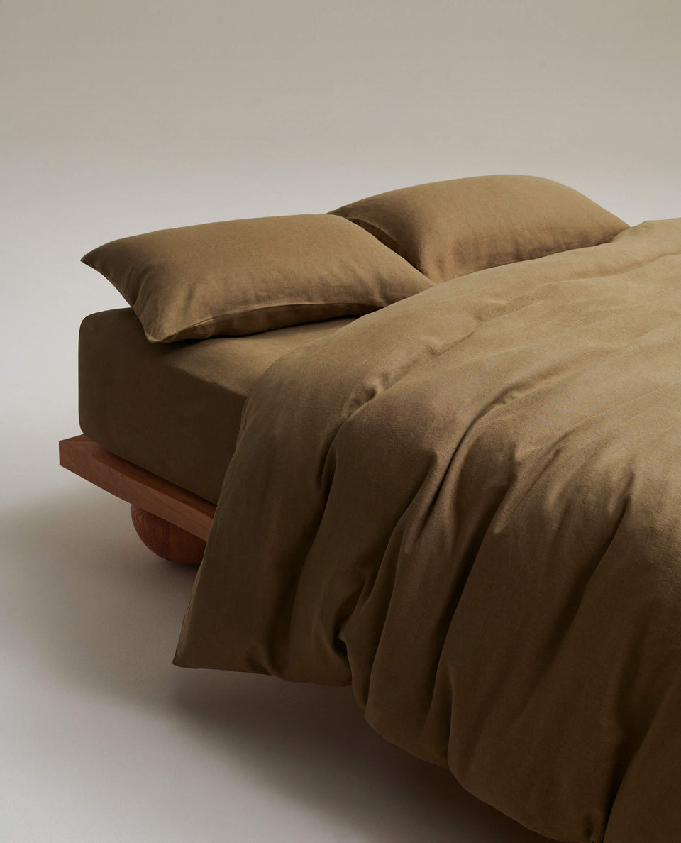 image 4 of 5 showing bed with Rise & Fall's Relaxed & Refined linen duvet set, fabric: European flax, colour: olive