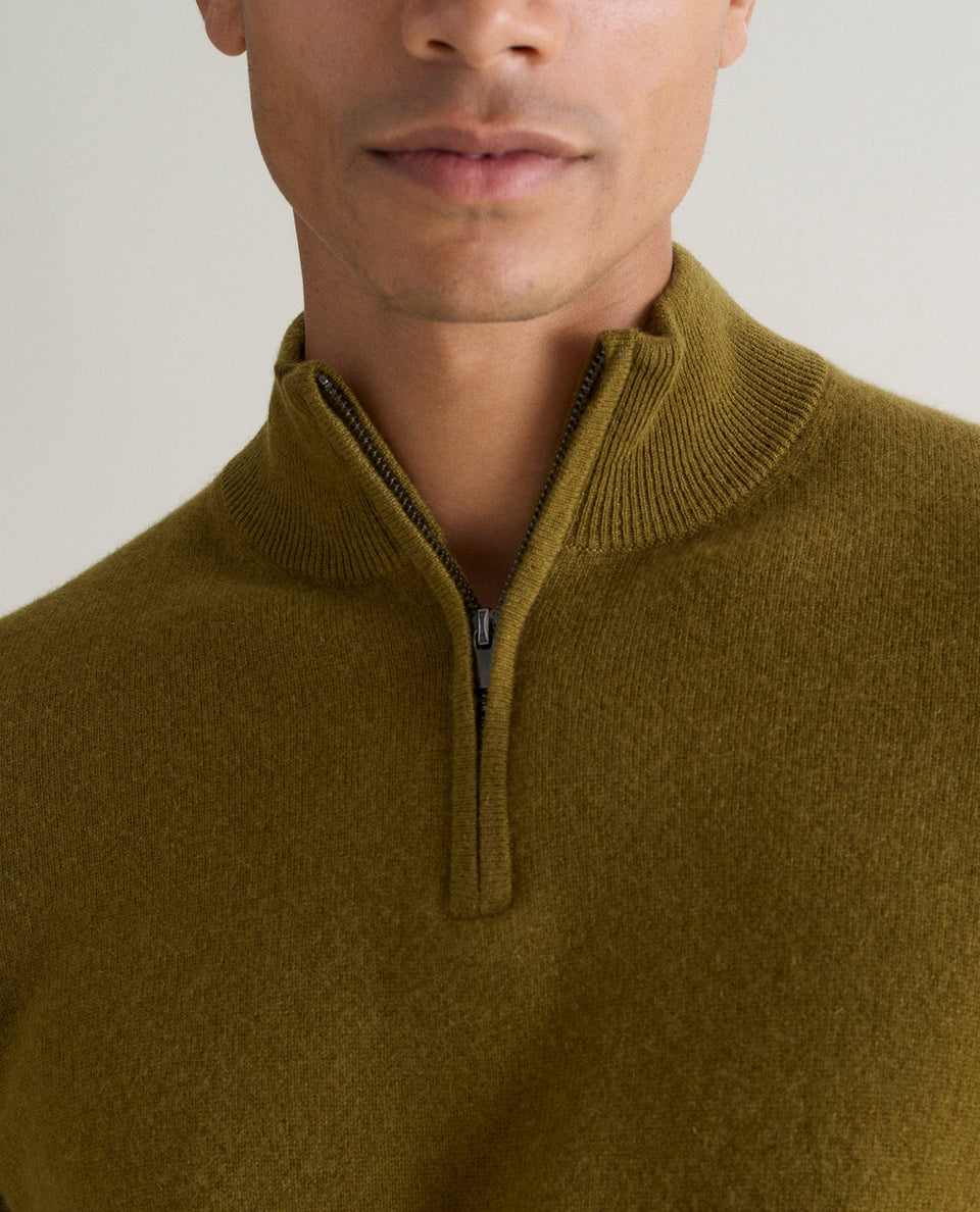 Image 4 of 5 showing man wearing Rise & Fall's fine cashmere 1/4 zip jumper, olive, close up.