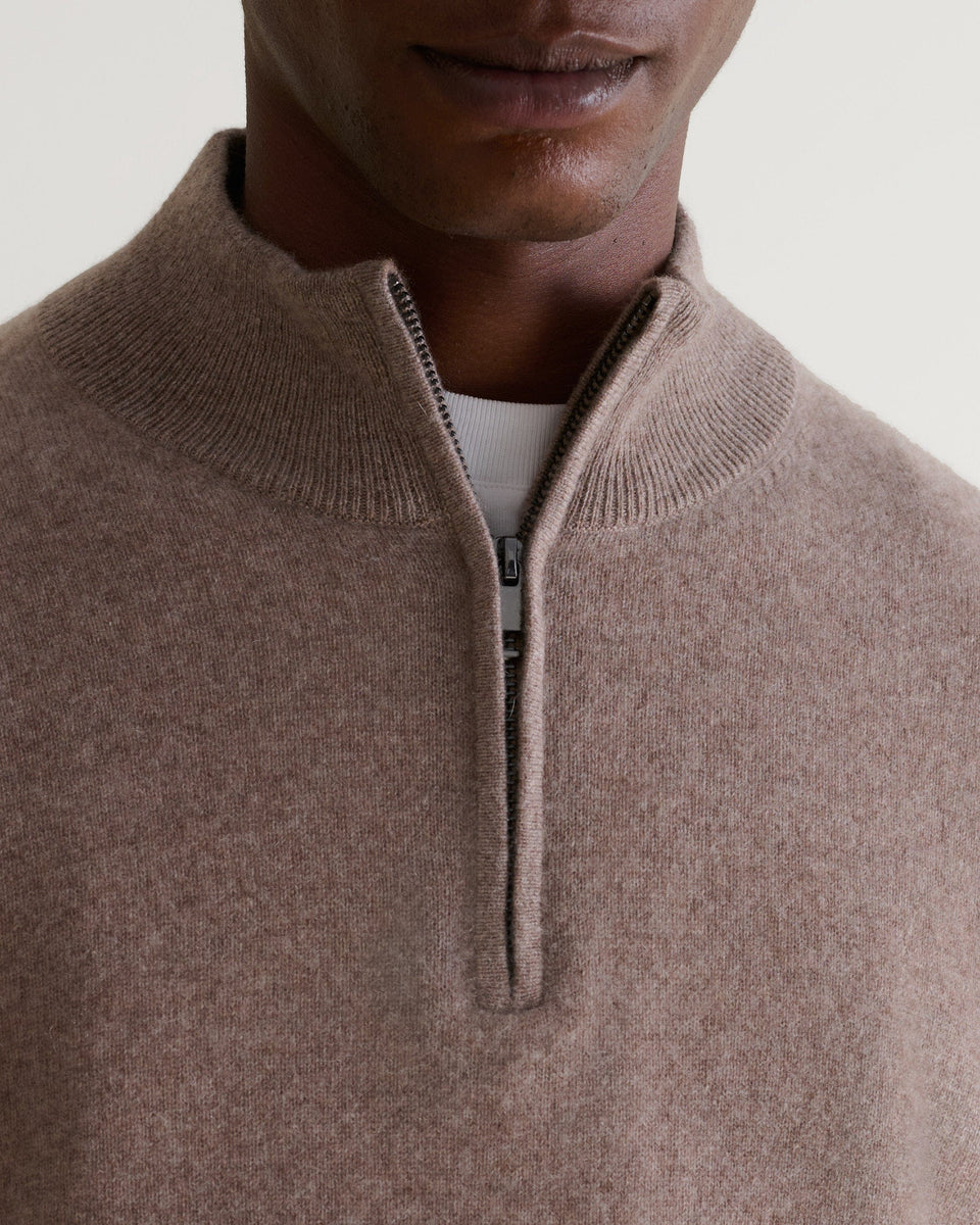 Image 4 of 5 showing man wearing Rise & Fall's fine cashmere 1/4 zip jumper, toast, close up.