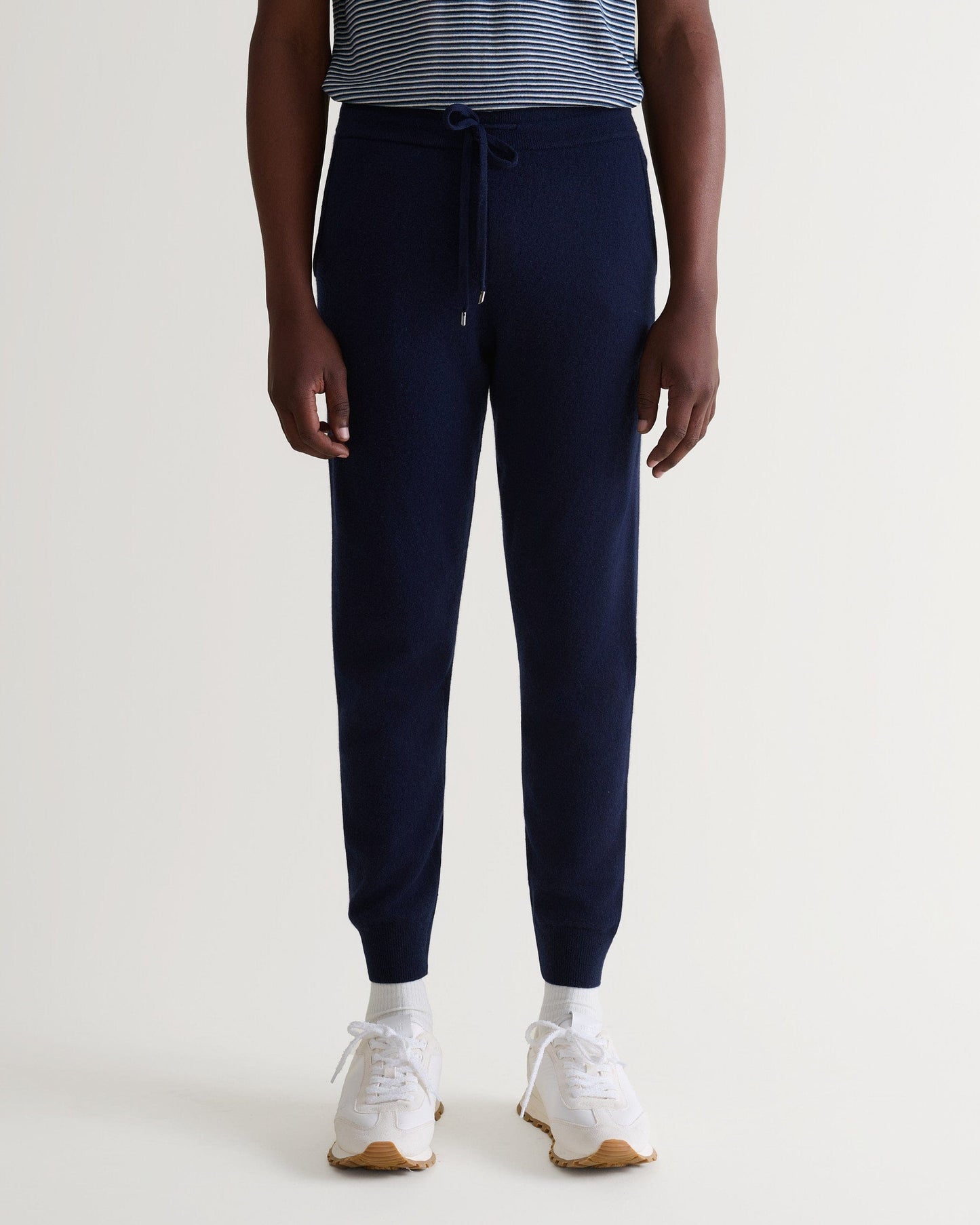 Image 4 of 5 showing man wearing Rise & Fall's fine cashmere jogger, navy. 