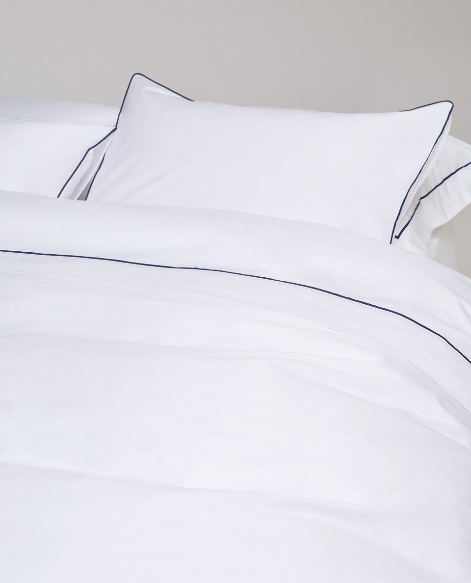 Image 4 of 5 showing Rise & Fall's percale cotton duvet cover, colour: white navy piping.