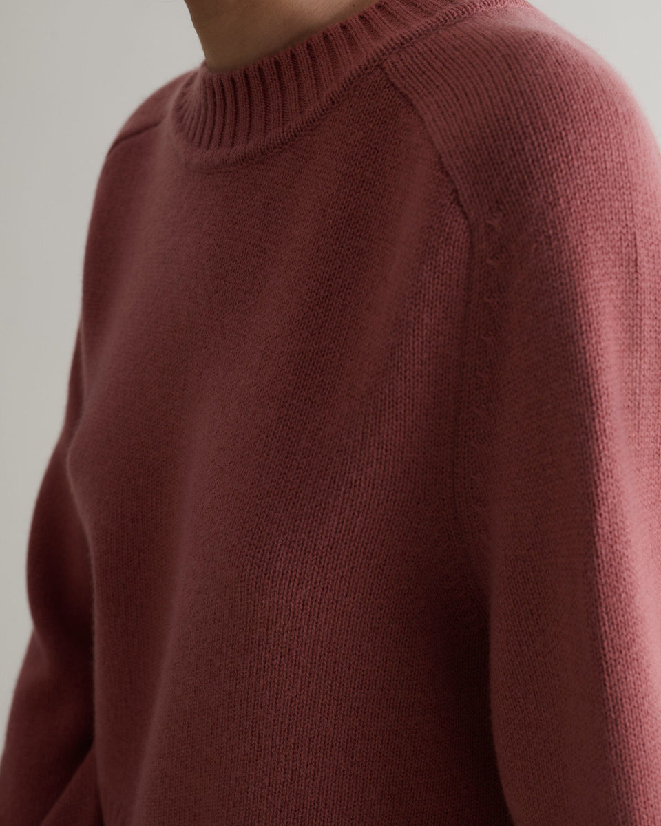 Image 4 of 5 showing close up of Rise & Fall cashmere merino saddle sleeve crew neck jumper, colour: pink clay.