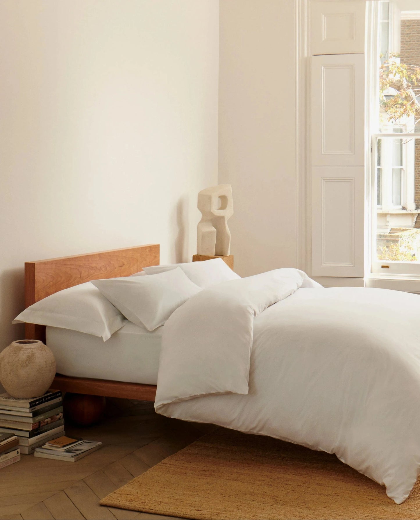 image 4 of 5 showing Rise & Fall's Soft & Smooth duvet set in bedroom setting, colour: white, fabric: sateen cotton