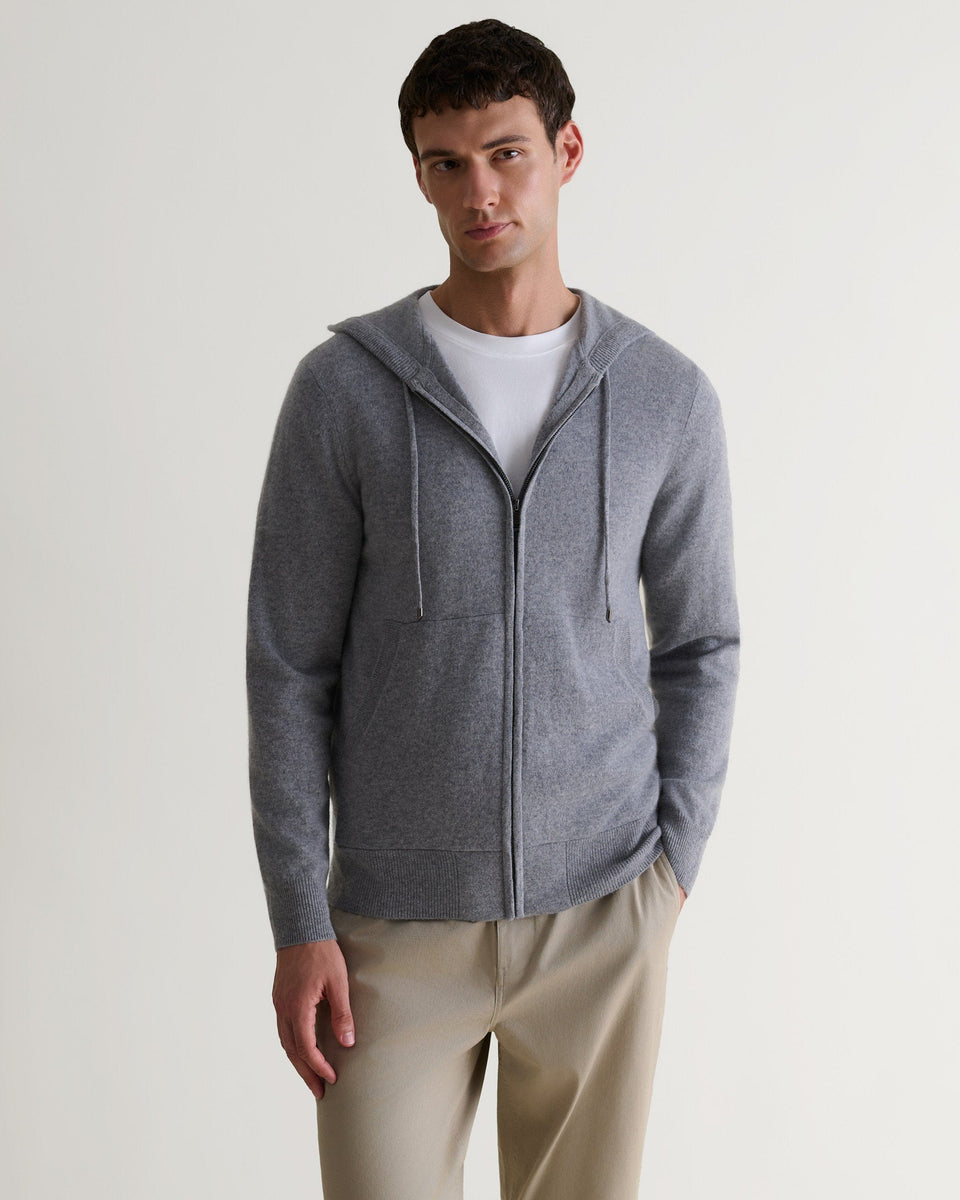 Image 4 of 6 showing man wearing Rise & Fall's fine cashmere zip hoodie, grey.