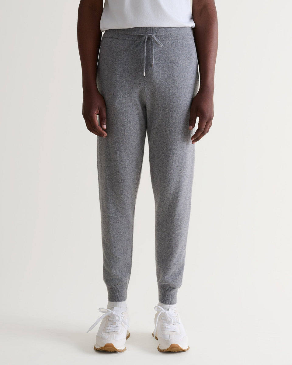 Image 4 of 6 showing man wearing Rise & Fall's fine cashmere joggers, grey.