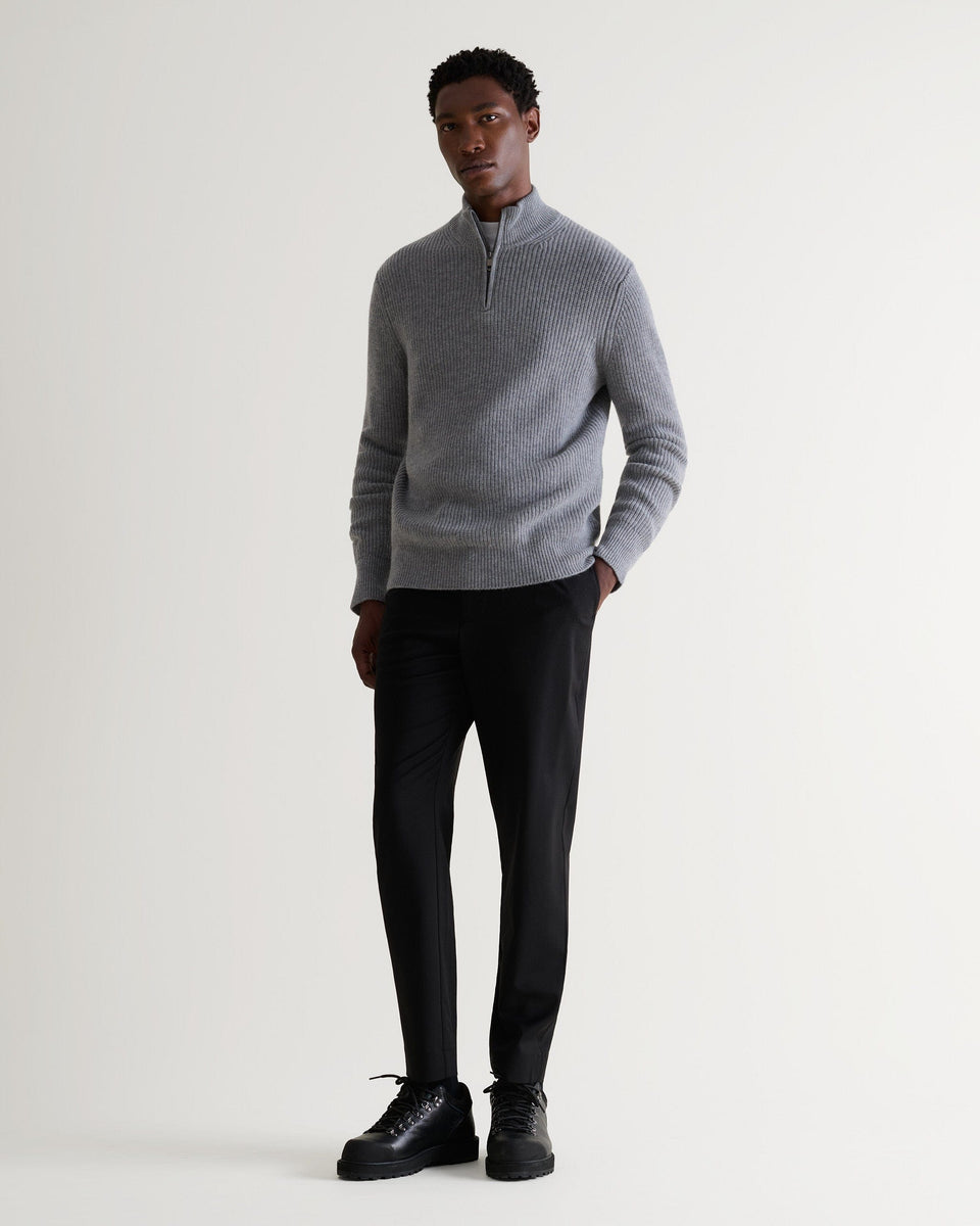 Image 4 of 6 showing man wearing Rise & Fall's Cashmere Merino Fishermans Rib 1/4 Zip Jumper in grey.