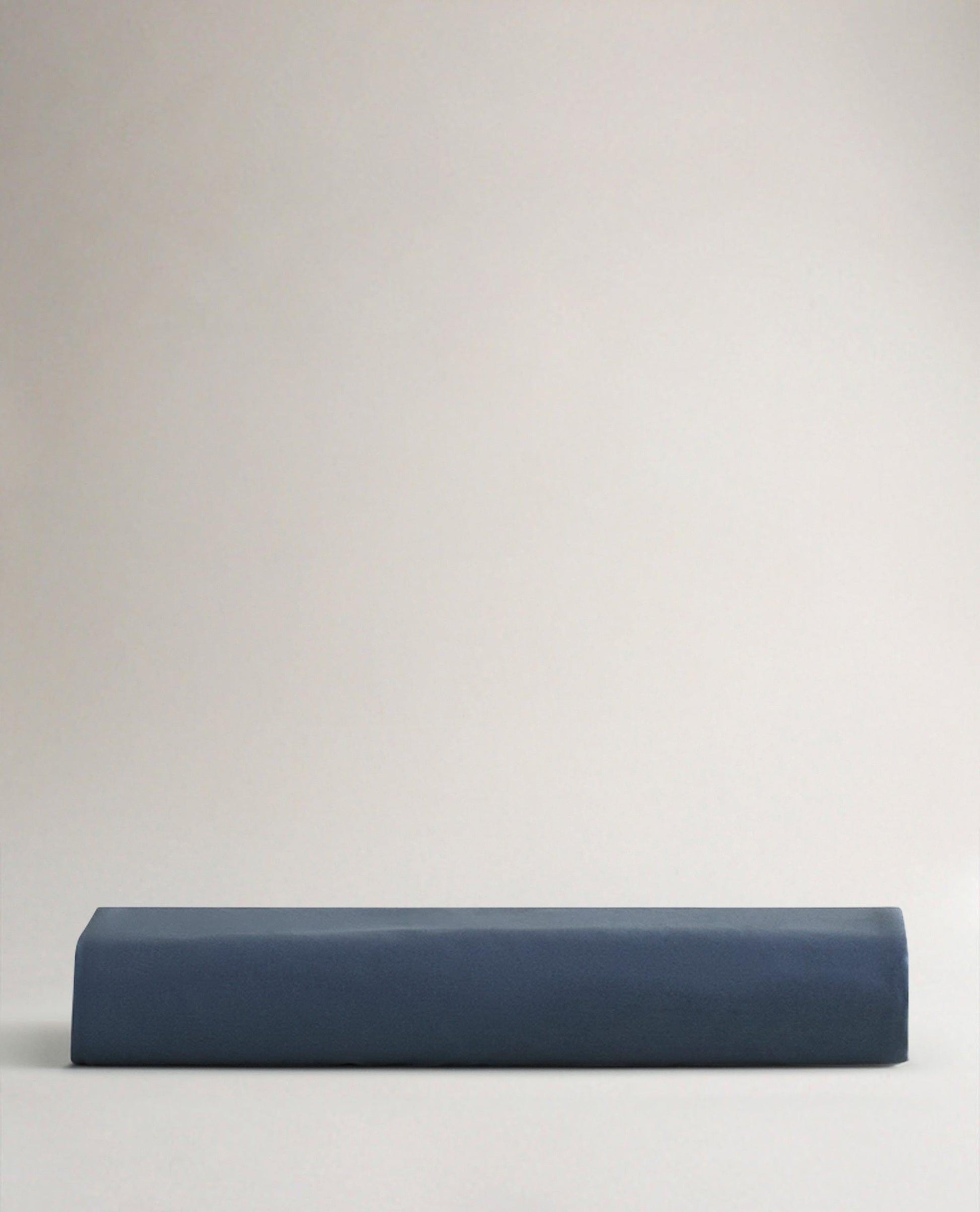 Image 4 of 6 showing Rise & Fall's Soft & Smooth sateen cotton deep fitted sheet in indigo.