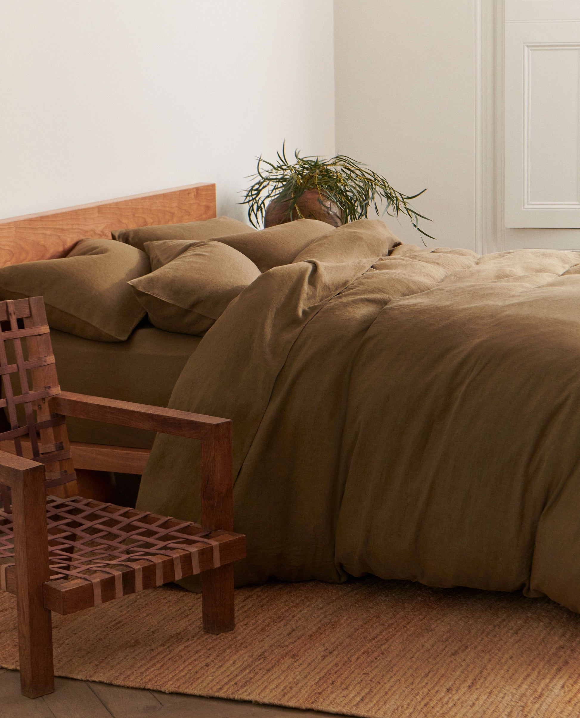 image 5 of 5 showing bed with Rise & Fall's Relaxed & Refined linen duvet set, fabric: European flax, colour: olive