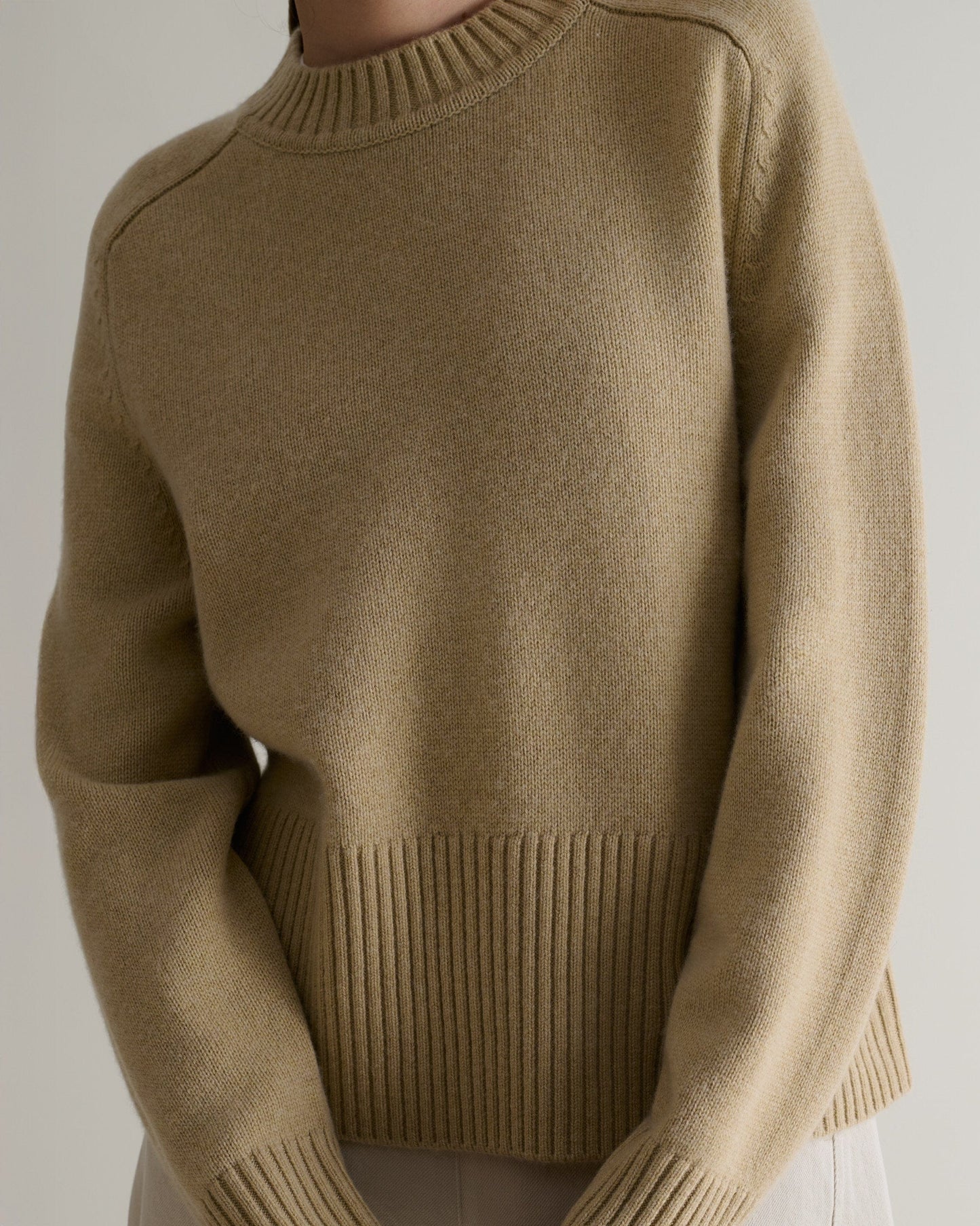 Image 5 of 5 showing close up of Rise & Fall's cashmere merino saddle sleeve crew neck jumper, colour: twine.