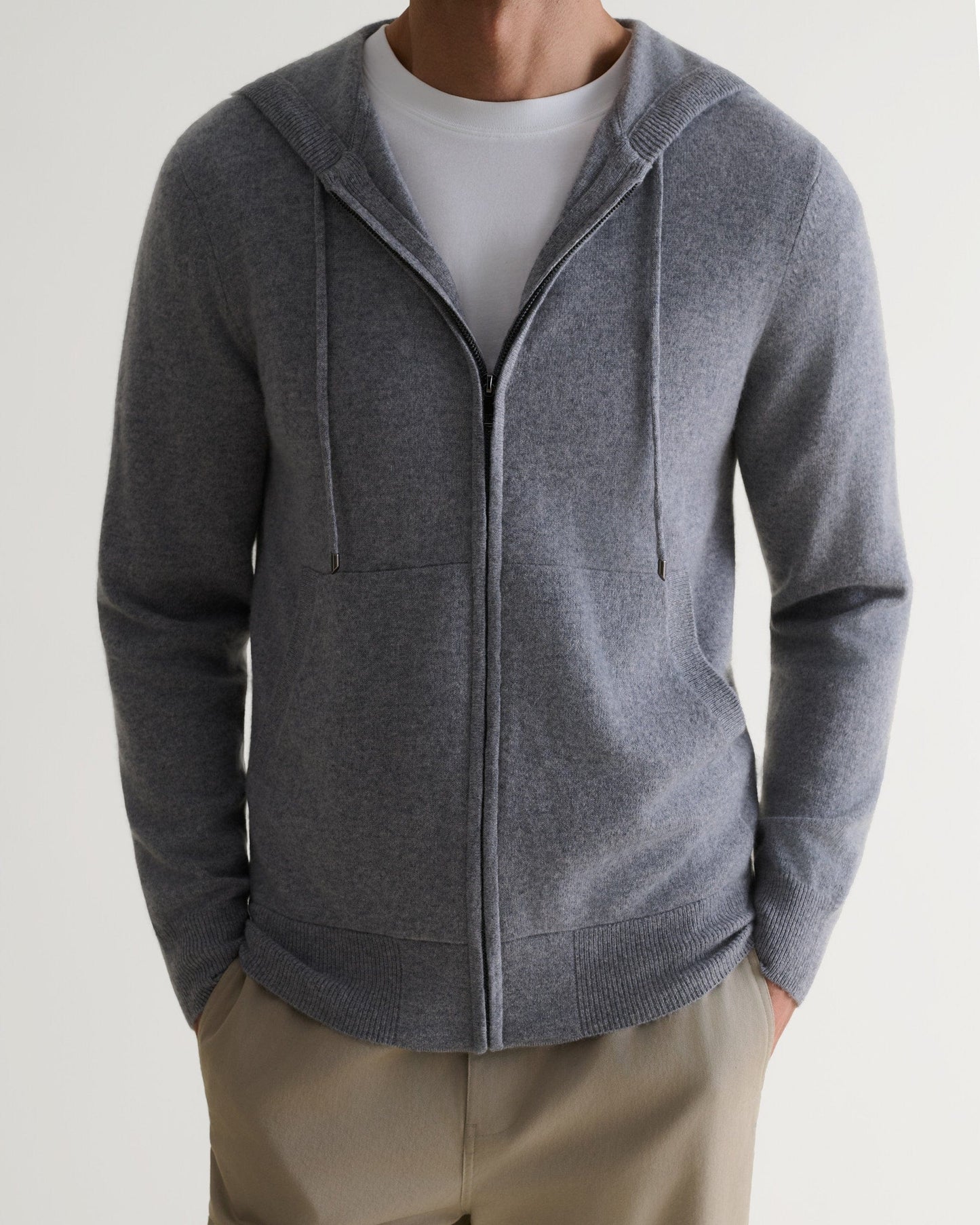 Image 5 of 6 showing man wearing Rise & Fall's fine cashmere zip hoodie, grey.