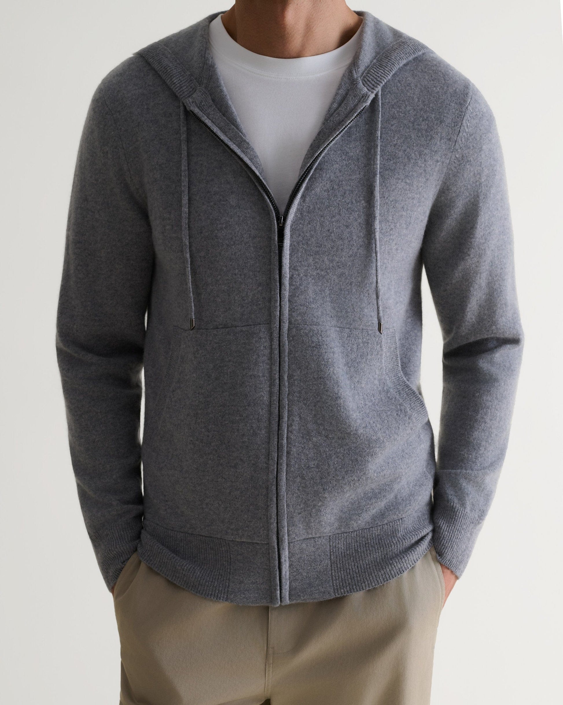 Image 5 of 6 showing man wearing Rise & Fall's fine cashmere zip hoodie, grey.