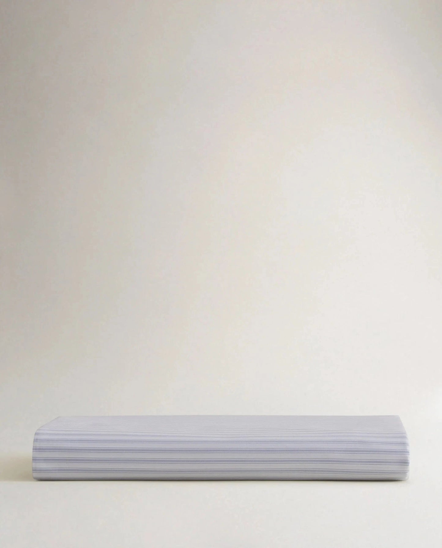 Image 5 of 6 showing Rise & Fall's Crisp & Cool organic cotton fitted sheet in blue stripe ticking.