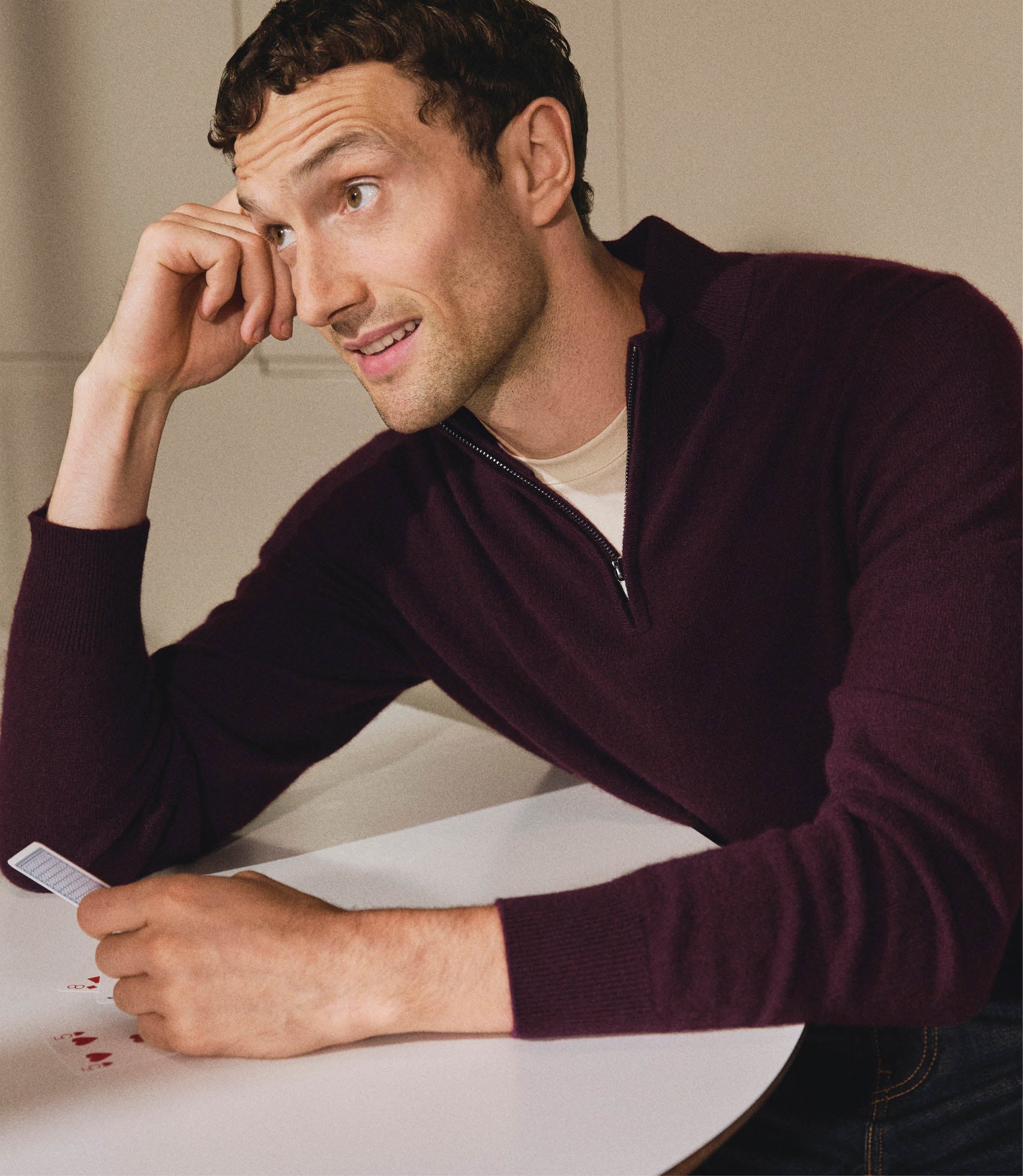 Image 6 of 6 showing man wearing Rise & Fall's fine cashmere 1/4 zip jumper, oxblood.