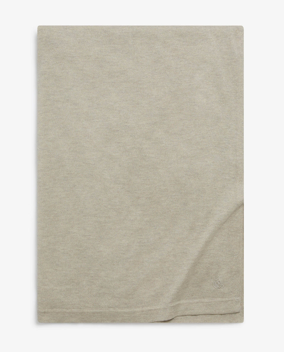 Image 6 of 6 showing Rise & Fall's oversized cashmere scarf around shoulders, colour: light beige.