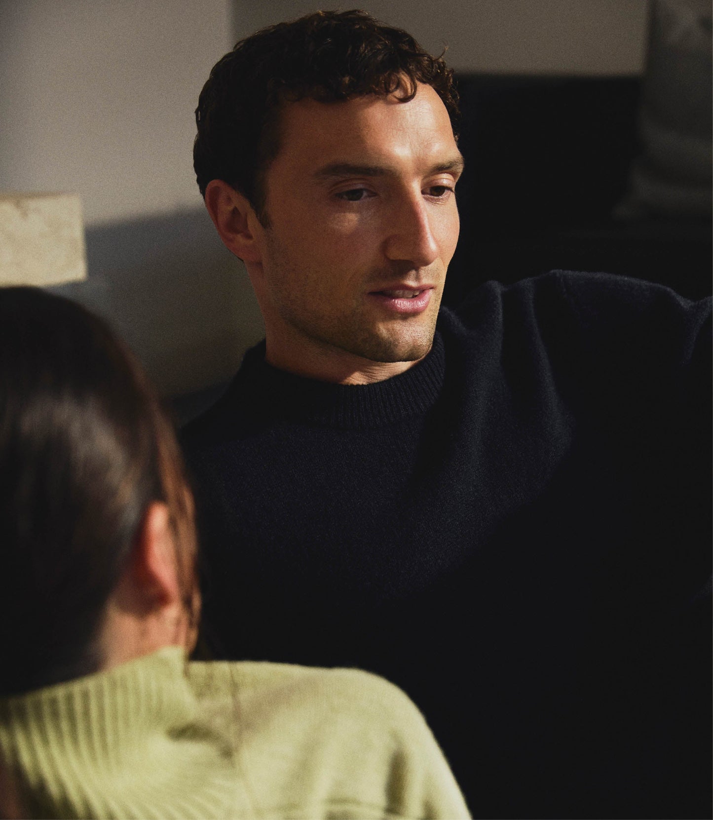 Image 7 of 7 showing man wearing Rise & Fall's Finest Cashmere Mid-Weight Crew Neck Jumper in black.