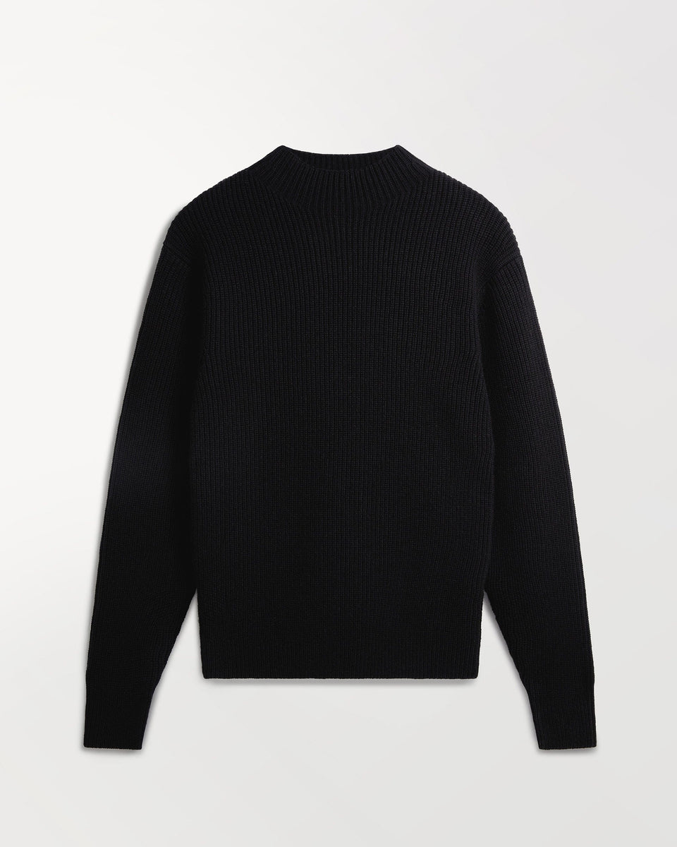 Close up of Rise & Fall's black cashmere merino stand neck jumper.