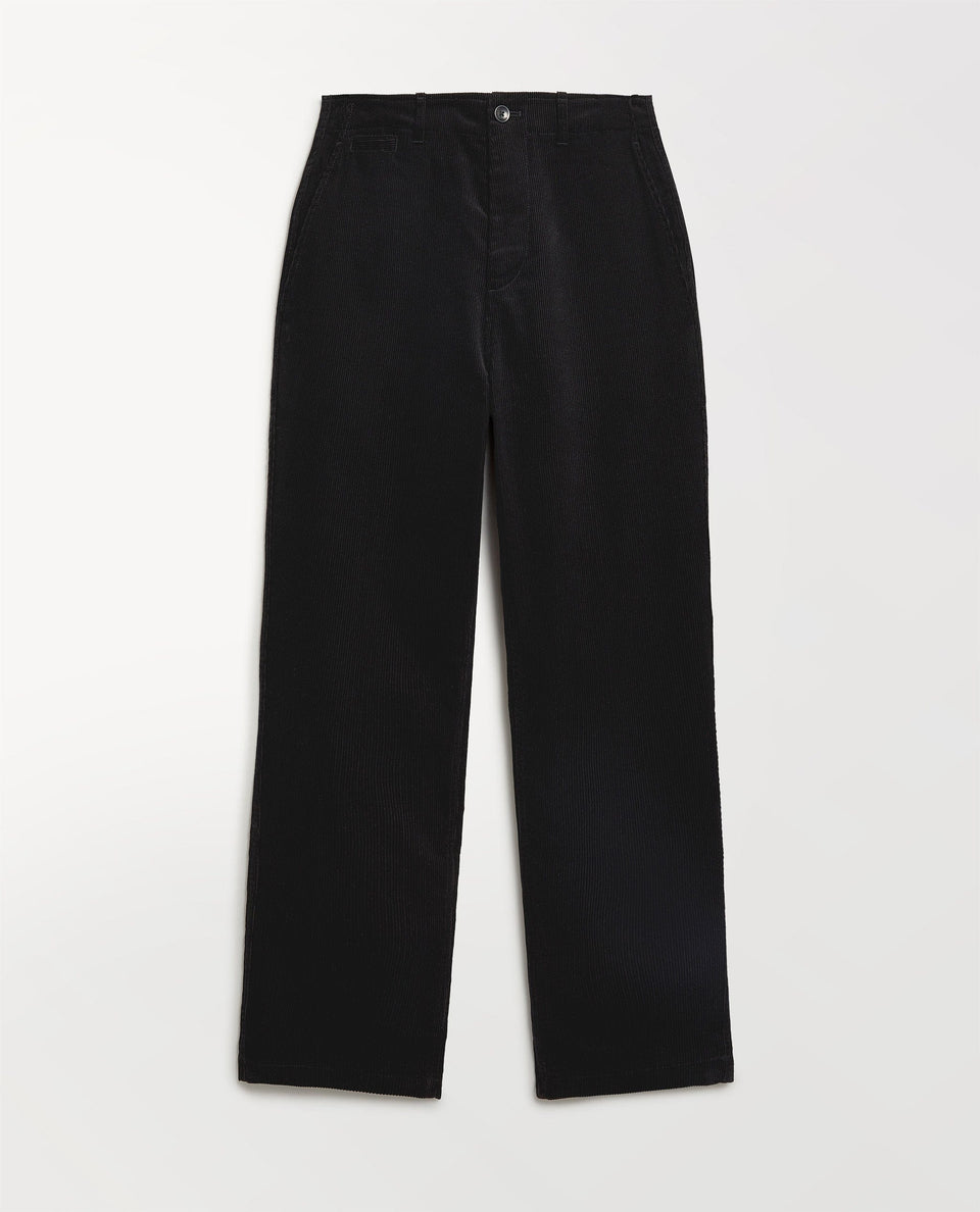 Close up of Rise & Fall's black corduroy trousers.