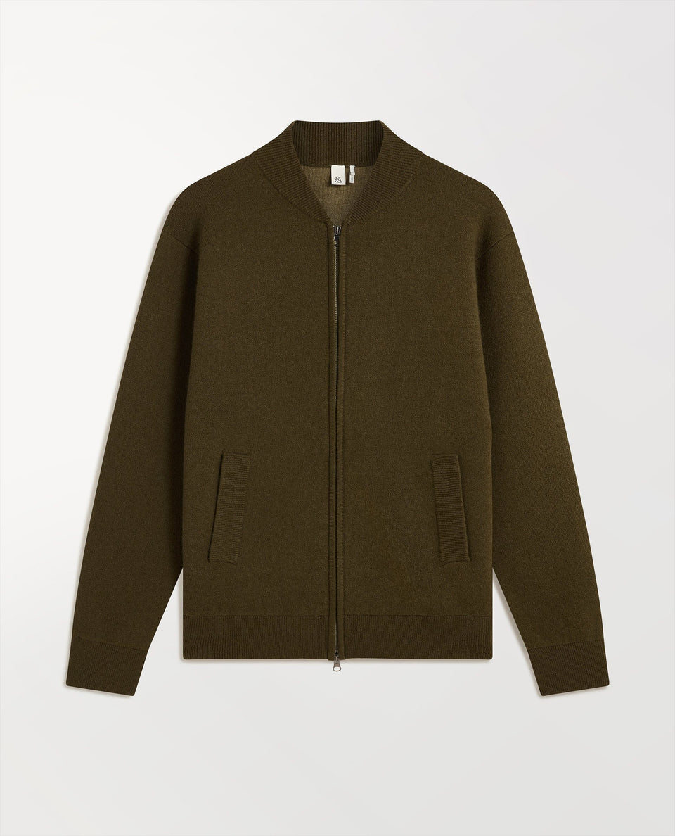 Close up of Rise & Fall's cashmere merino double faced bomber jacket in military green.