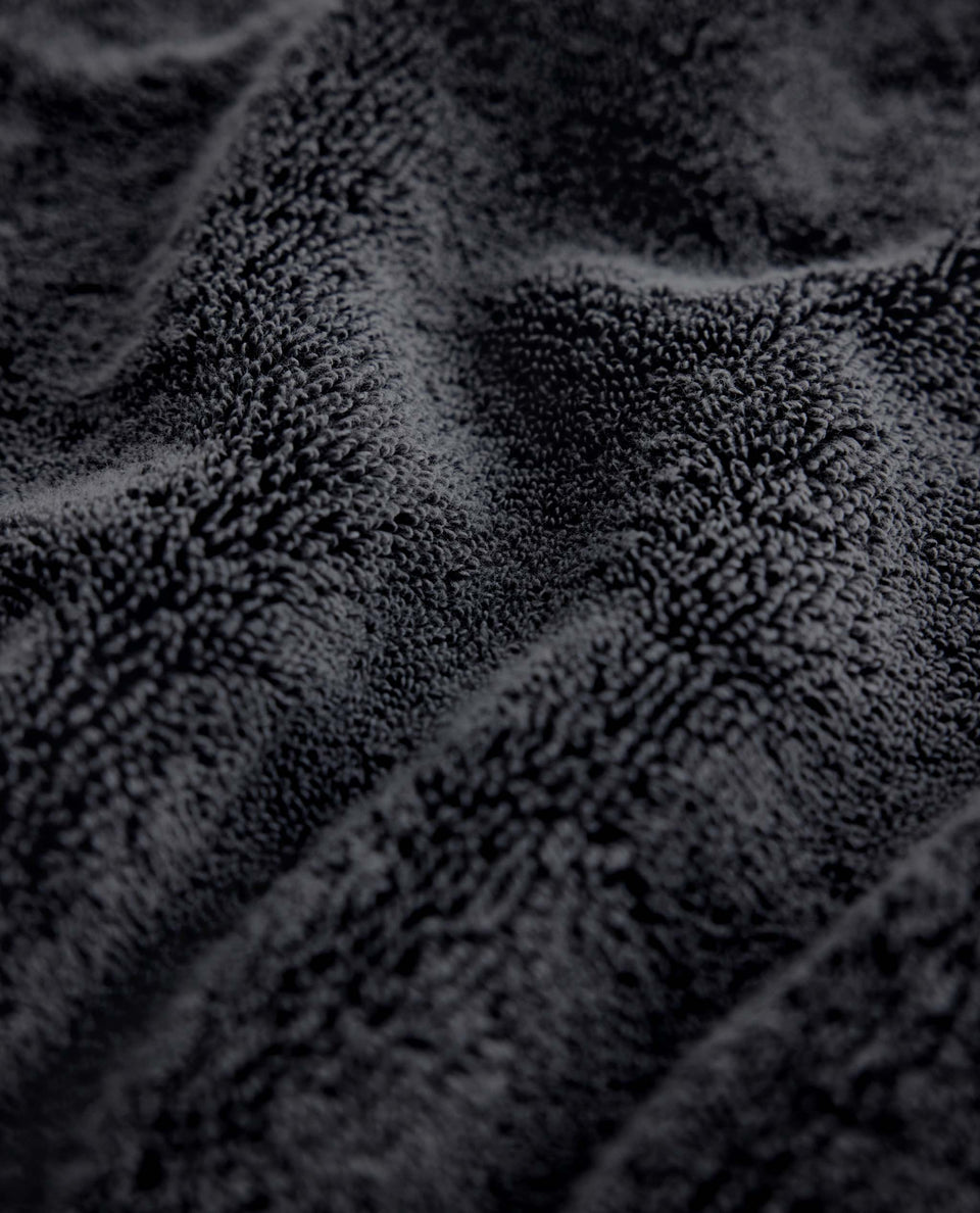 Close up of Rise & Fall's charcoal turkish aegean cotton towel